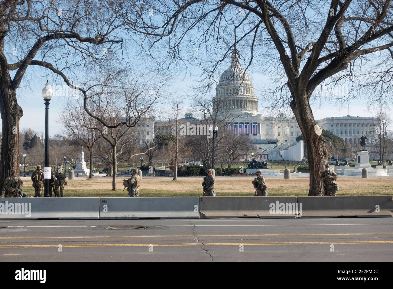 WASHINGTON, DC - JAN. 14, 2021: National Guard stand watch around the U.S. Capitol in a show of force in preparation for anticipated Trump extremist protests and Joe Biden's upcoming inauguration. Stock Photo