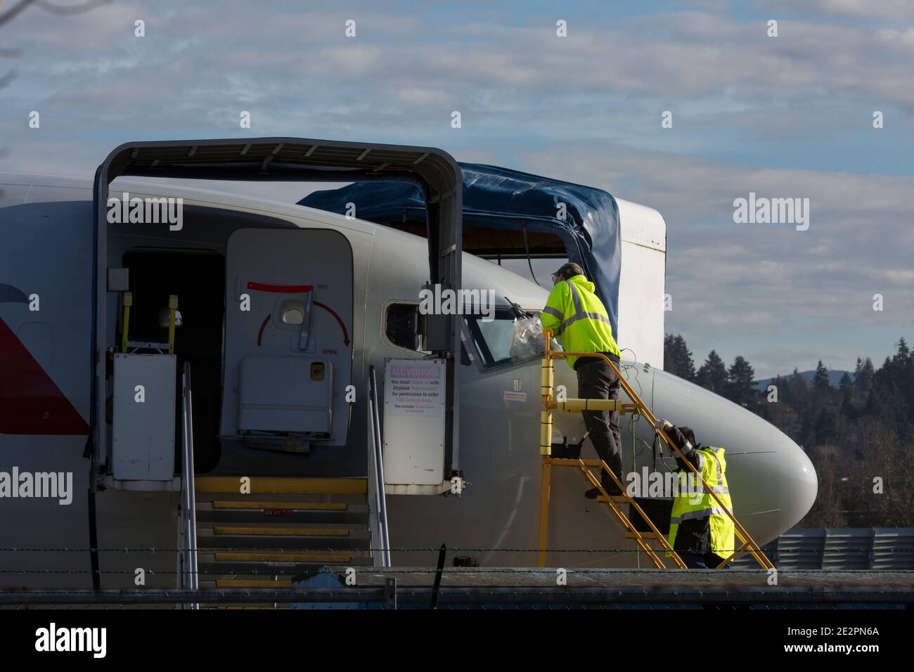 Employees work on an American Airlines 737 MAX airplane at the Boeing Renton Factory in Renton, Washington on Thursday, January 14, 2021. Stock Photo