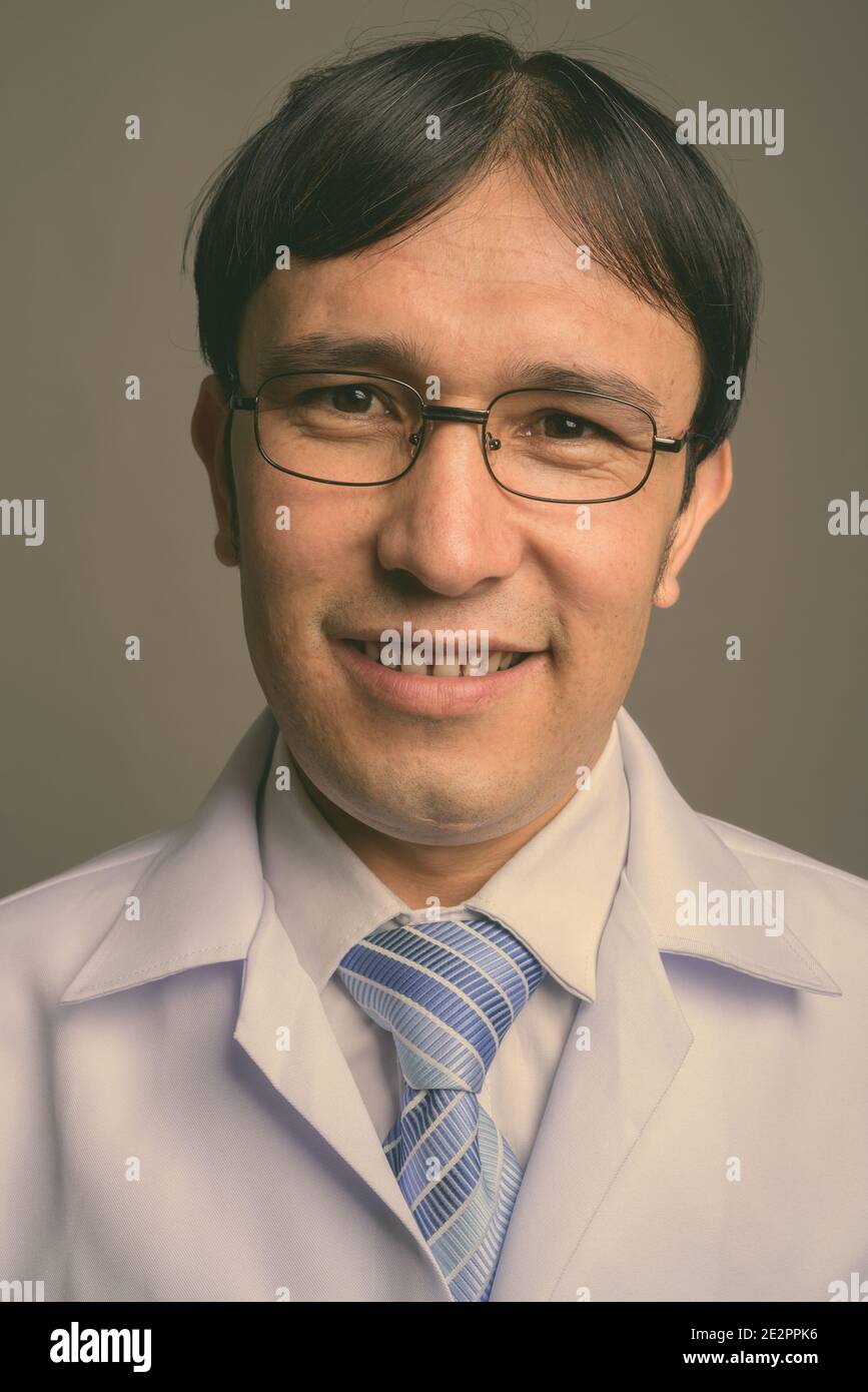 Happy persian man doctor wearing hi-res stock photography and images ...