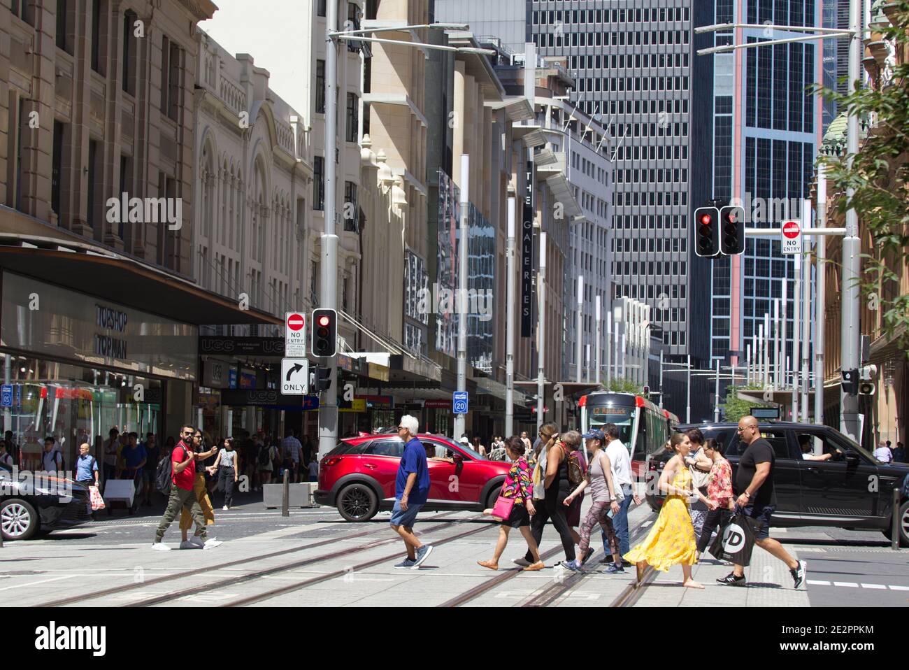 Busy shopping pedestrians crossing George Street Sydney Australia Stock Photo