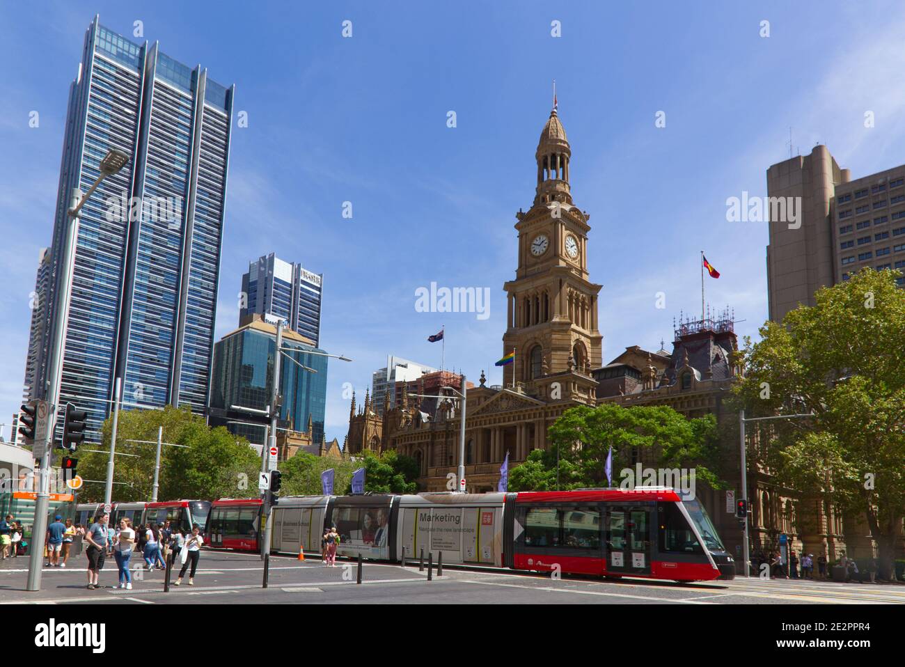 Pedestrians crossing George street in front of the Sydney Town Hall Australia Stock Photo