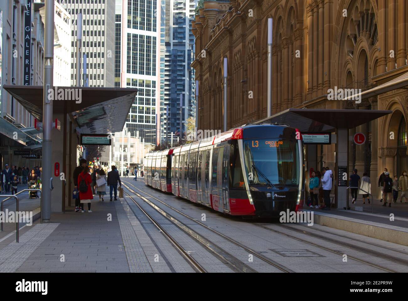 Sydney Light Rail public transport system stopping at Queen Victoria Building on George Street Sydney Australia Stock Photo