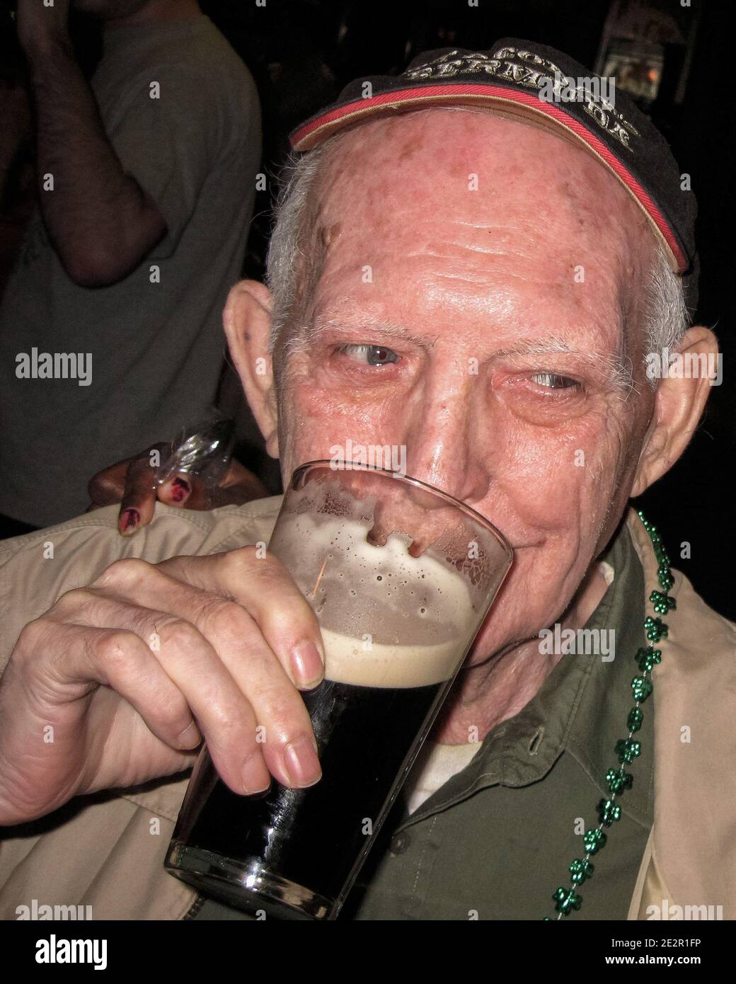 Black hand, The Guinness drinker Stock Photo