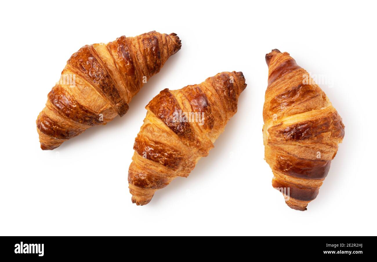 Three croissants on a white background. A view from above Stock Photo