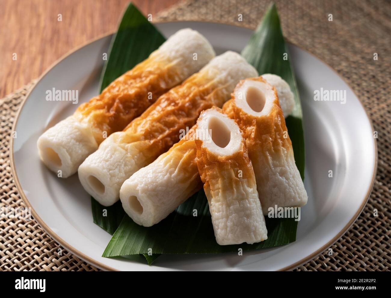 Japanese chikuwa served on a white plate on a wooden background