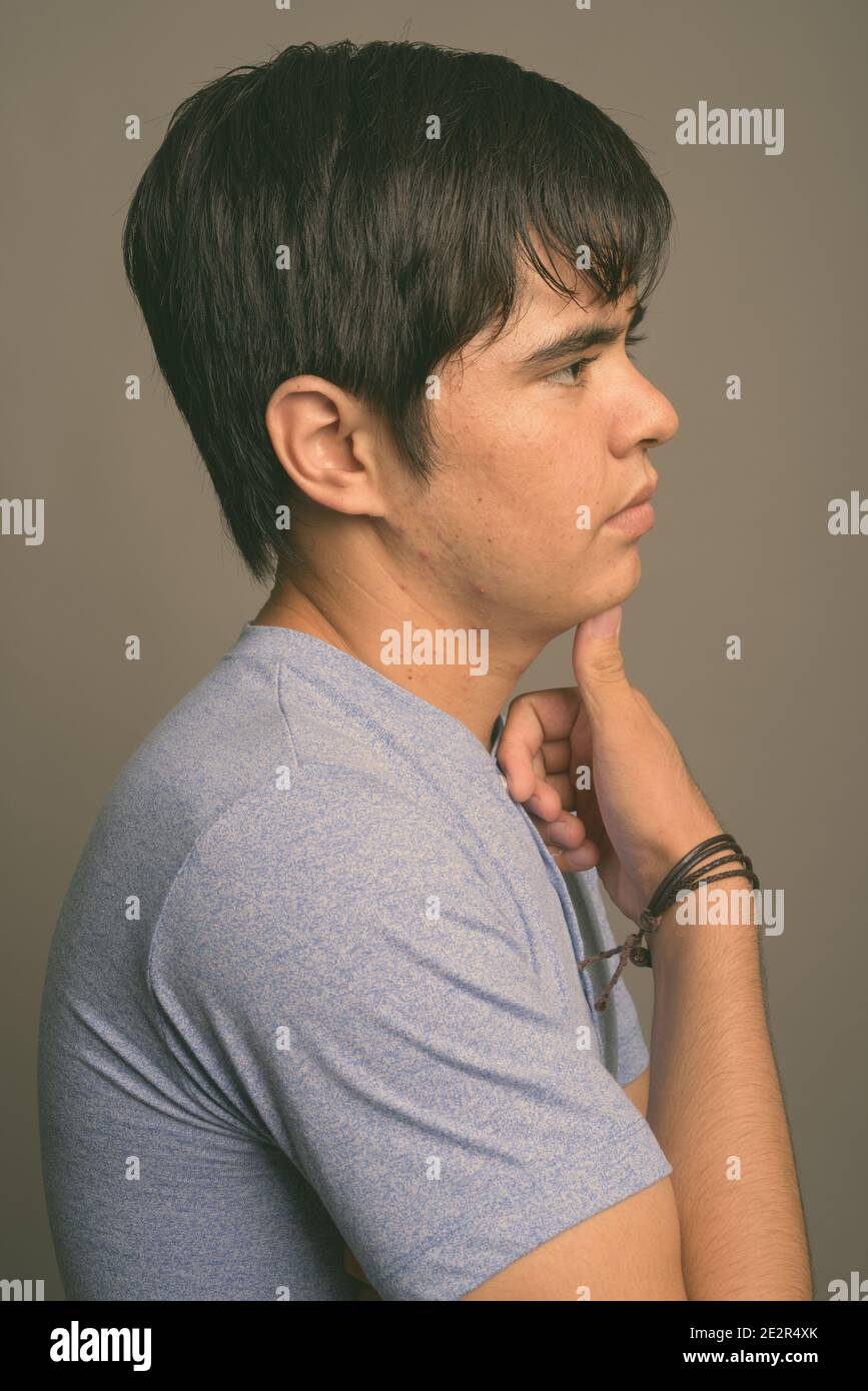 Asian boy wearing blue shirt hi-res stock photography and images - Alamy