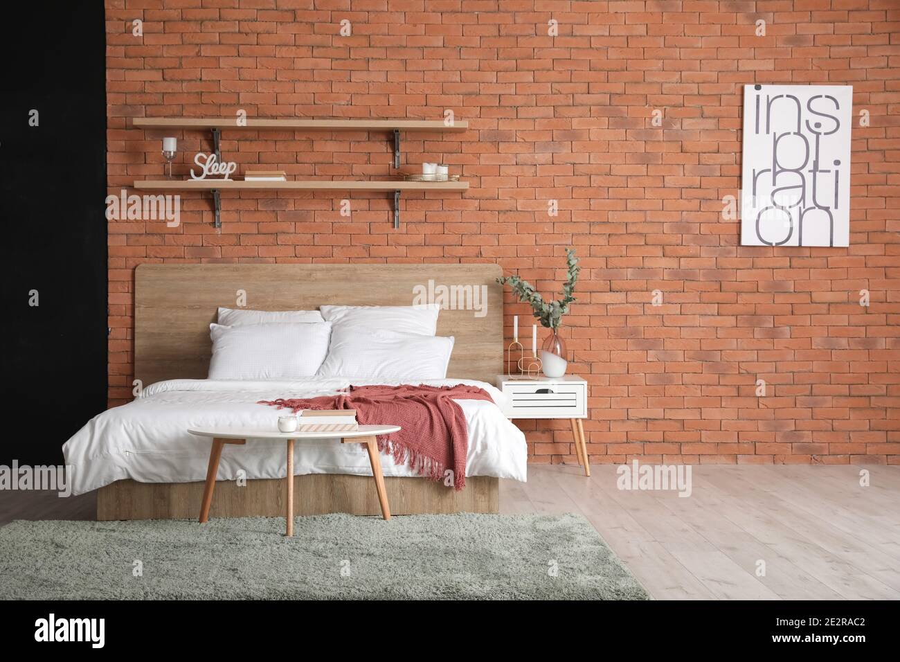 Interior of bedroom with brick wall Stock Photo - Alamy