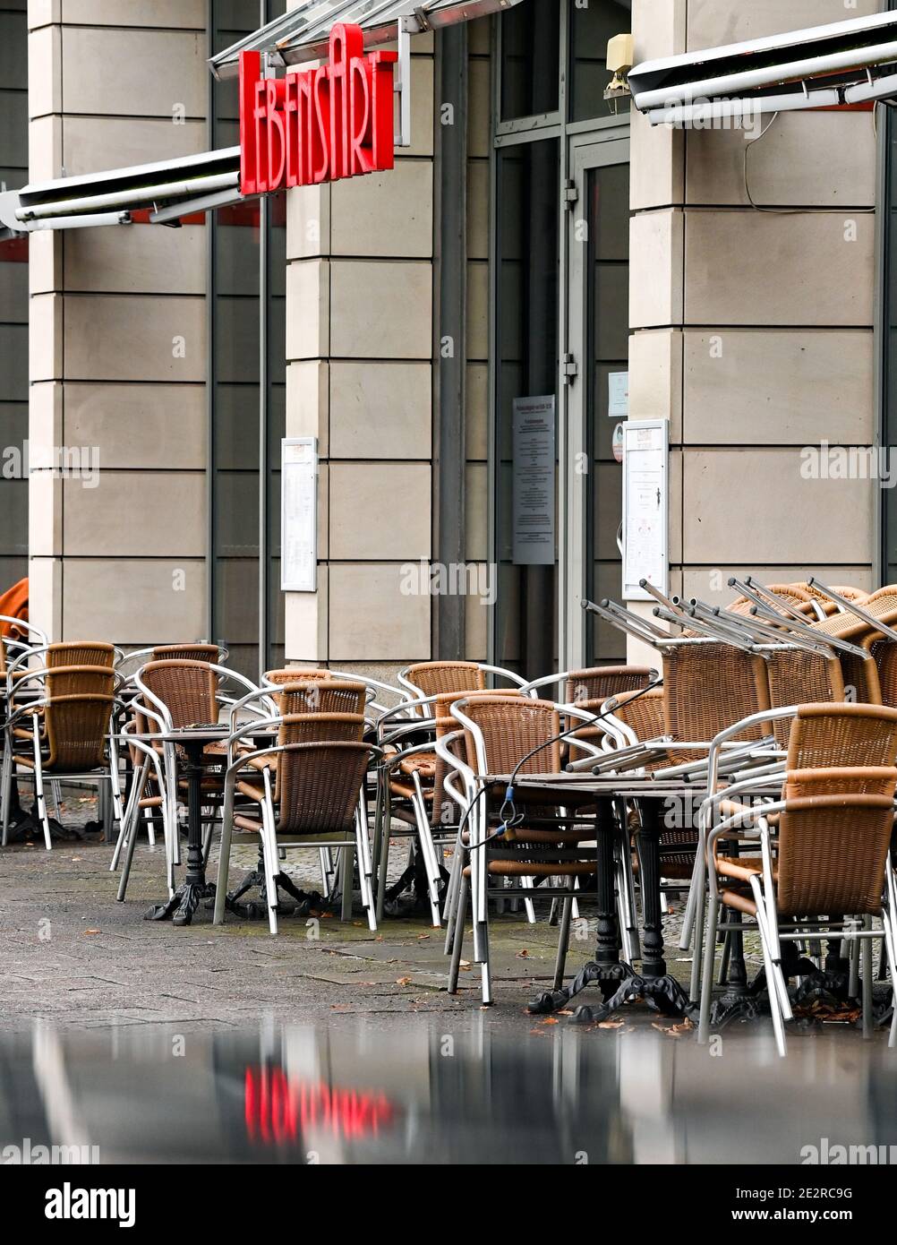 Berlin, Germany. 14th Jan, 2021. Stacked chairs and locked tables from Cafe Lebensart Unter dem Linden. Due to the lockdown shops, cafes and restaurants are closed. Credit: Jens Kalaene/dpa-Zentralbild/ZB/dpa/Alamy Live News Stock Photo
