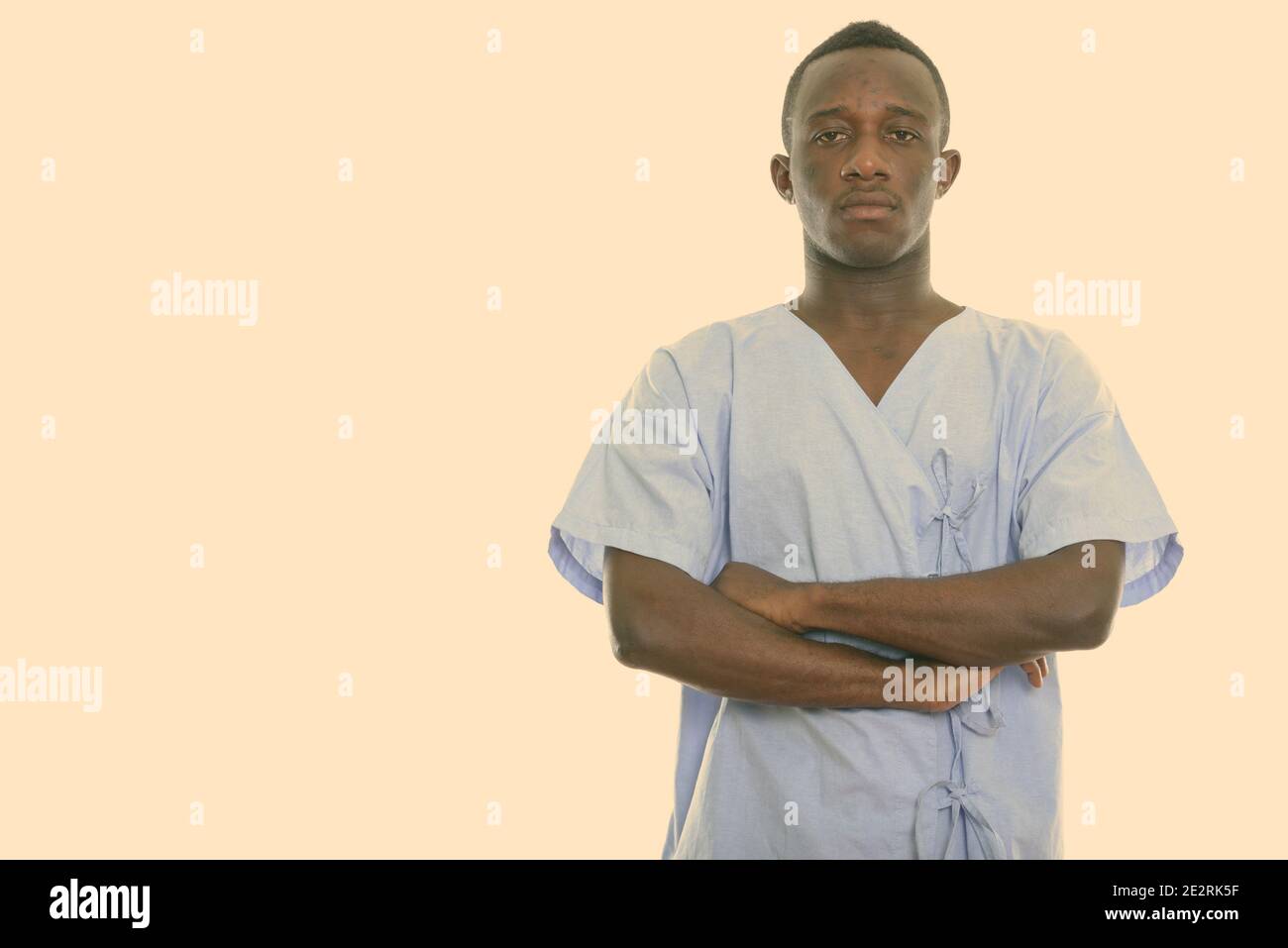 Studio shot of young black African man patient with arms crossed Stock ...