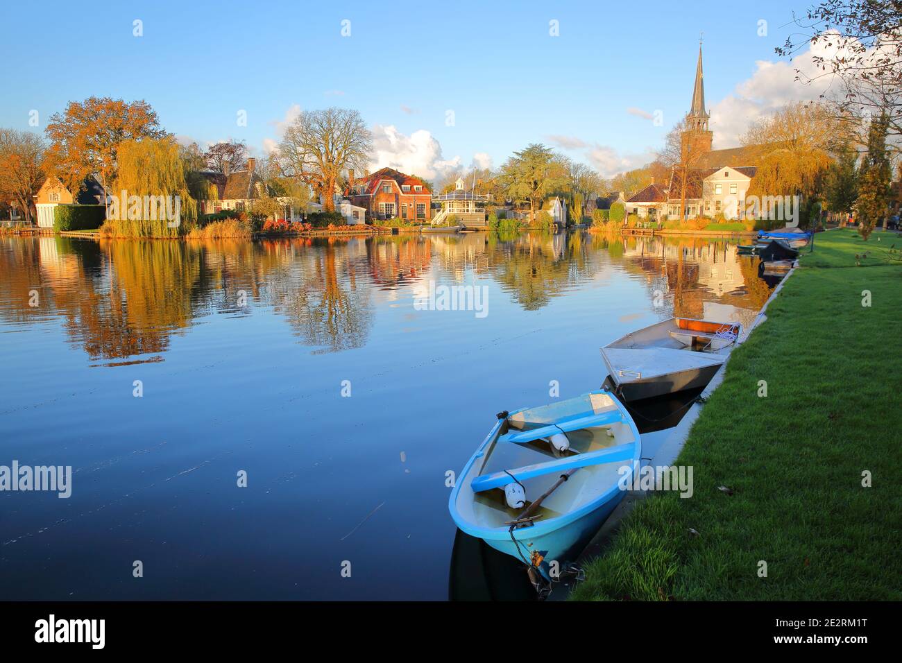 Broek in Waterland, a small town with traditional old and painted wooden houses, North Holland, Netherlands, with reflections of the houses Stock Photo