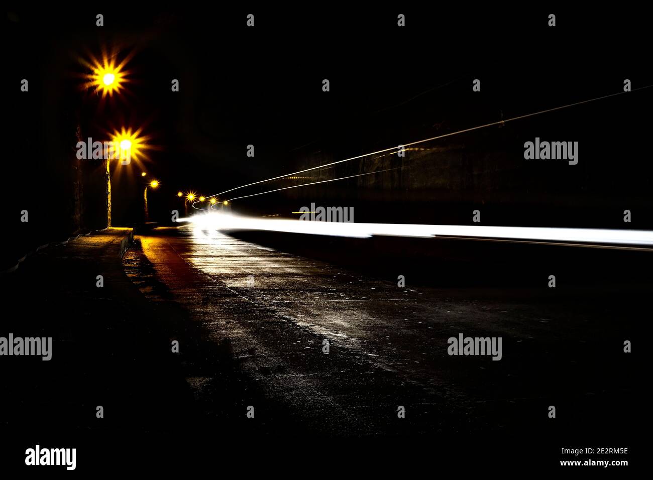 A dark olt tunnel with light trails. Stock Photo