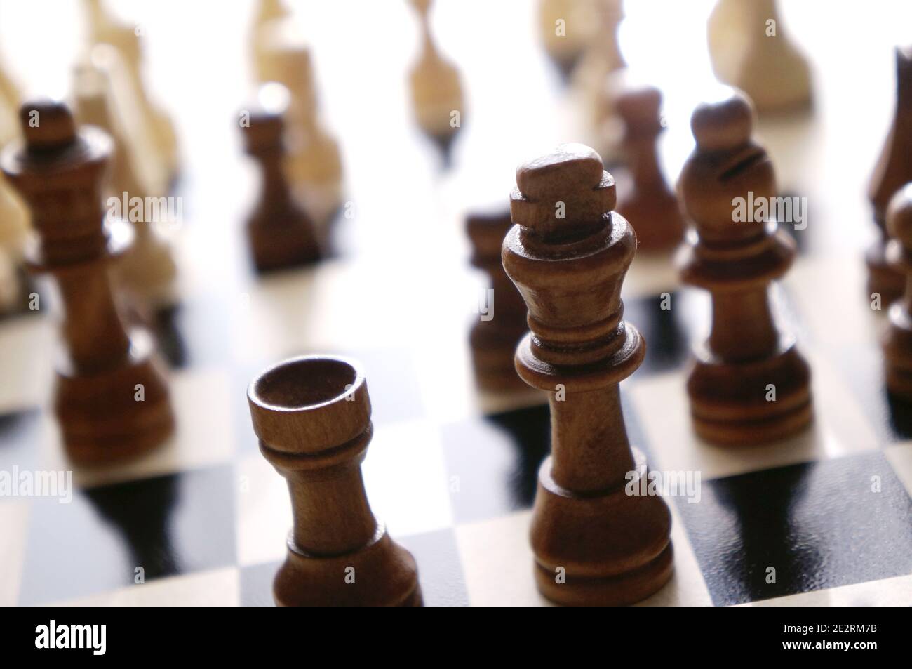 Wood chess pieces on a board Stock Photo