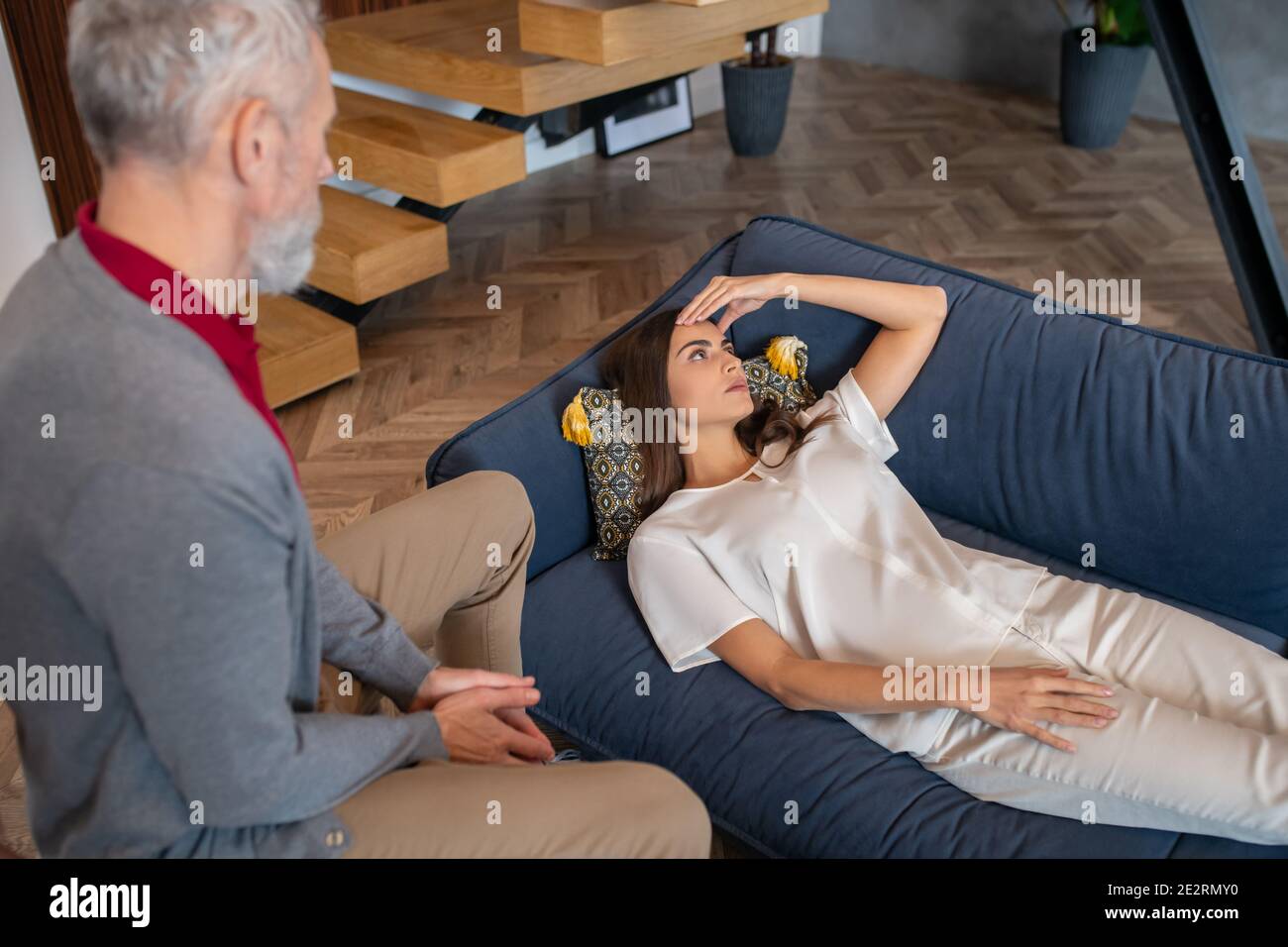 Man taking care of woman having a headache Stock Photo