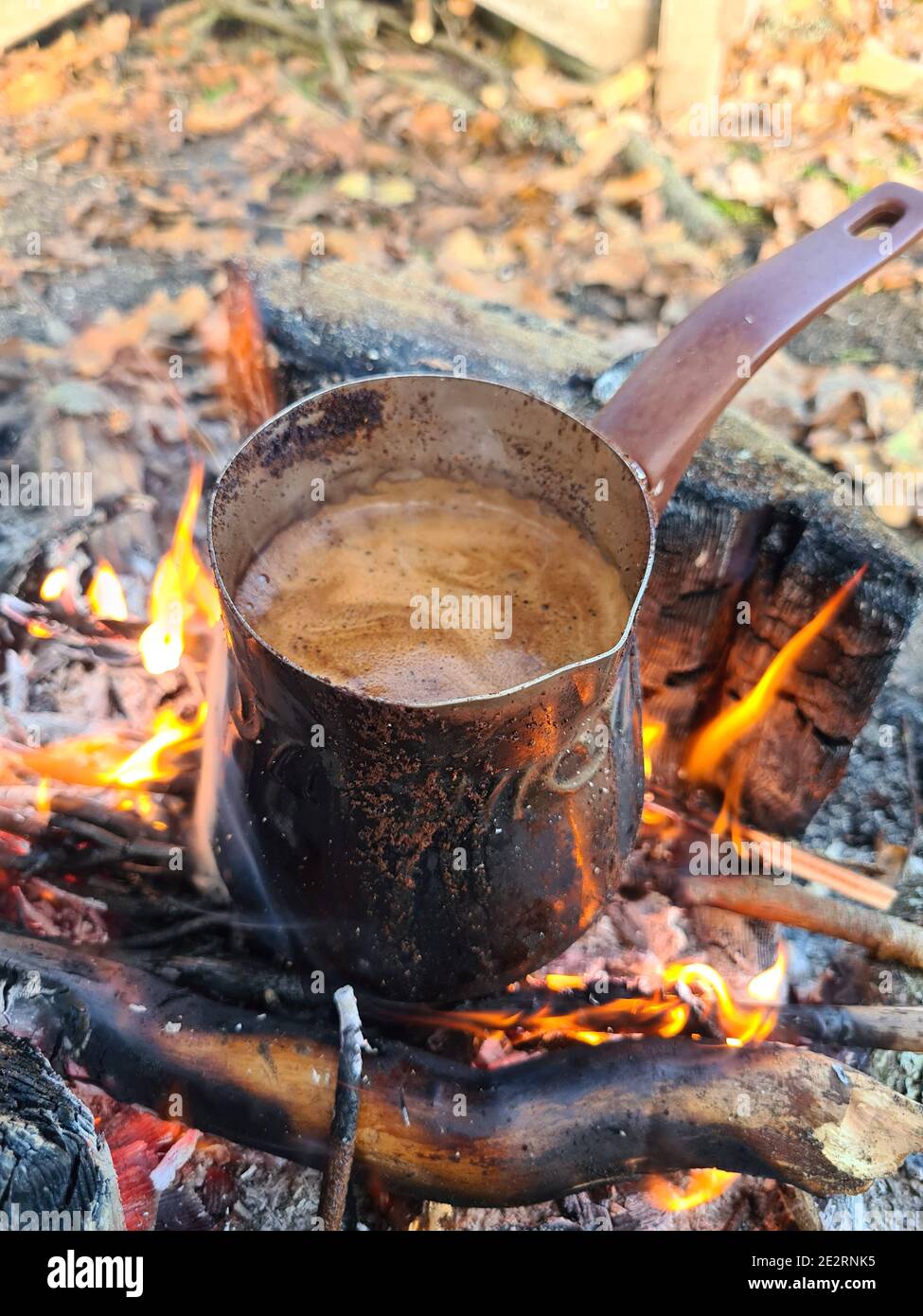 https://c8.alamy.com/comp/2E2RNK5/coffee-is-prepared-in-cezve-on-fire-vertical-image-2E2RNK5.jpg