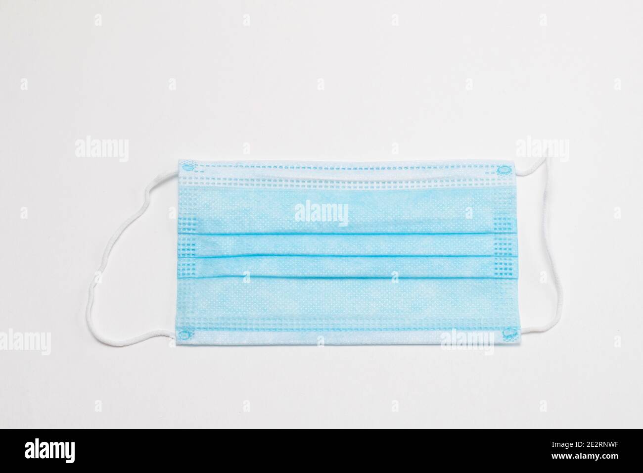 Blue Protection Mask Medical blue protective mask isolated on white background. Prevent ...
