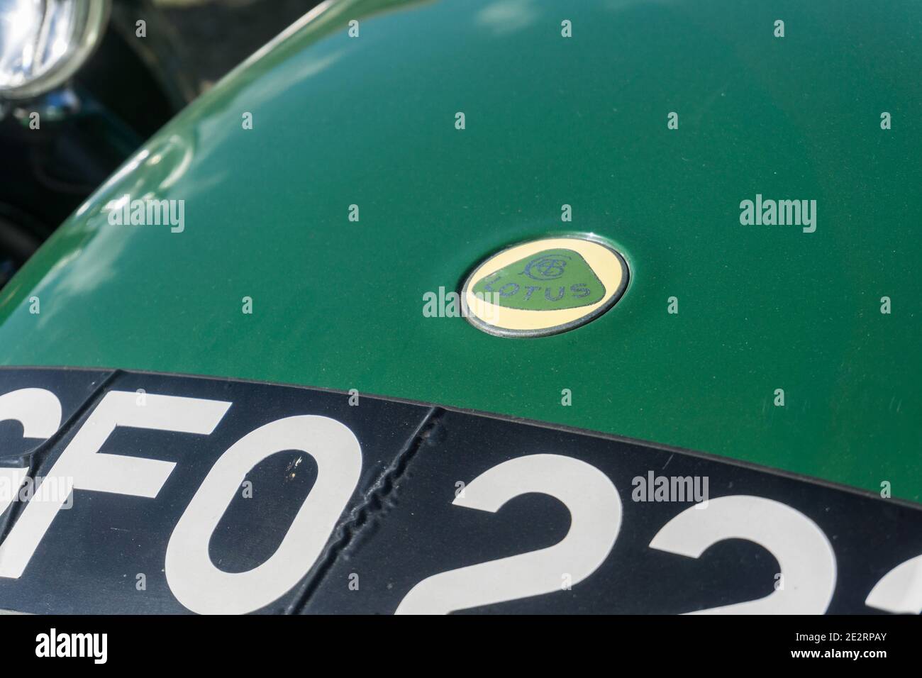 Close up detail of the bonnet, badge and number plate on a British racing  green 1960s Lotus Seven lightweight open top sports car Stock Photo - Alamy