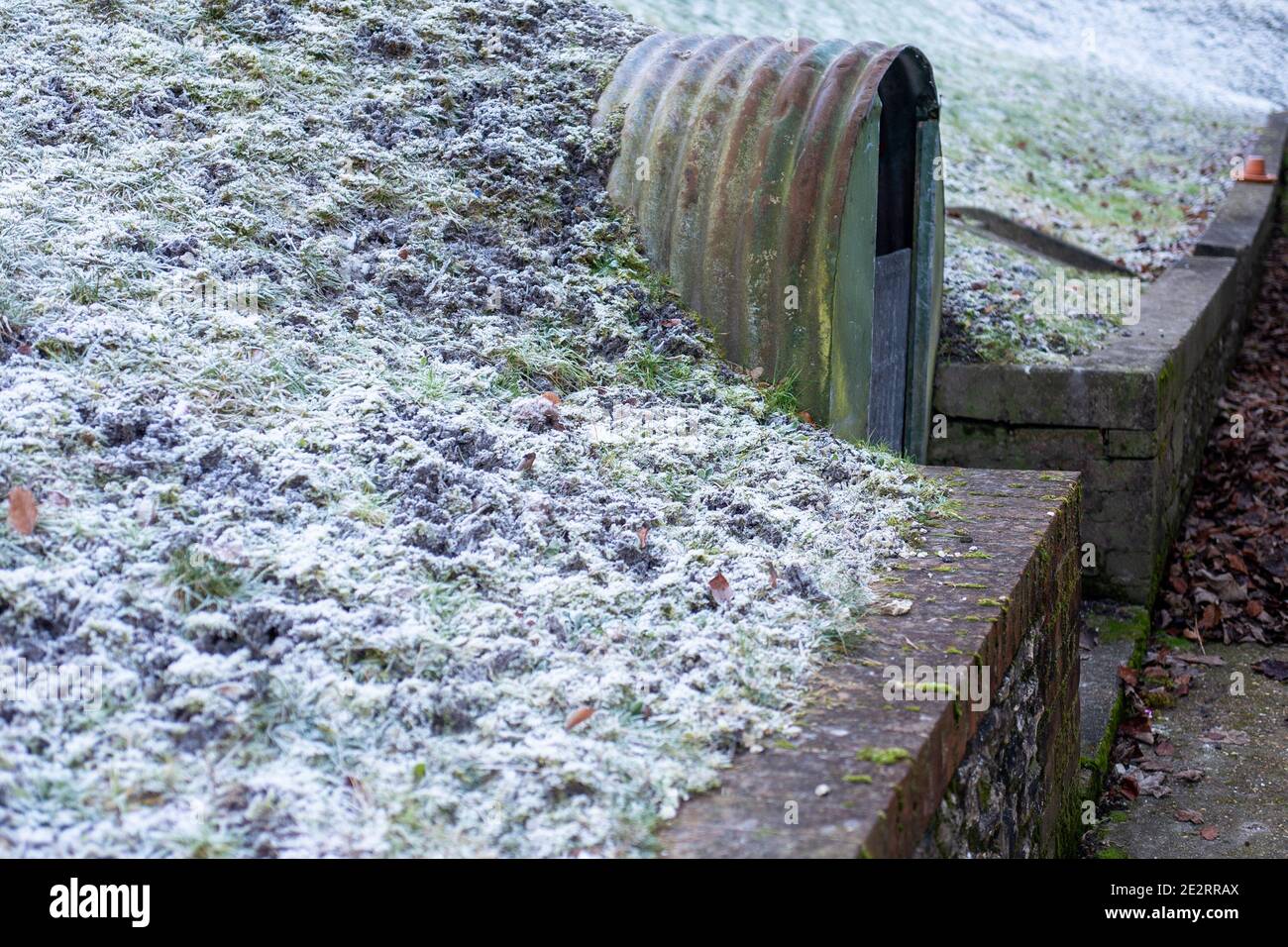 Abandoned Anderson shelter at the home of John Lewis, the founder of the general store in Hampshire. Stock Photo