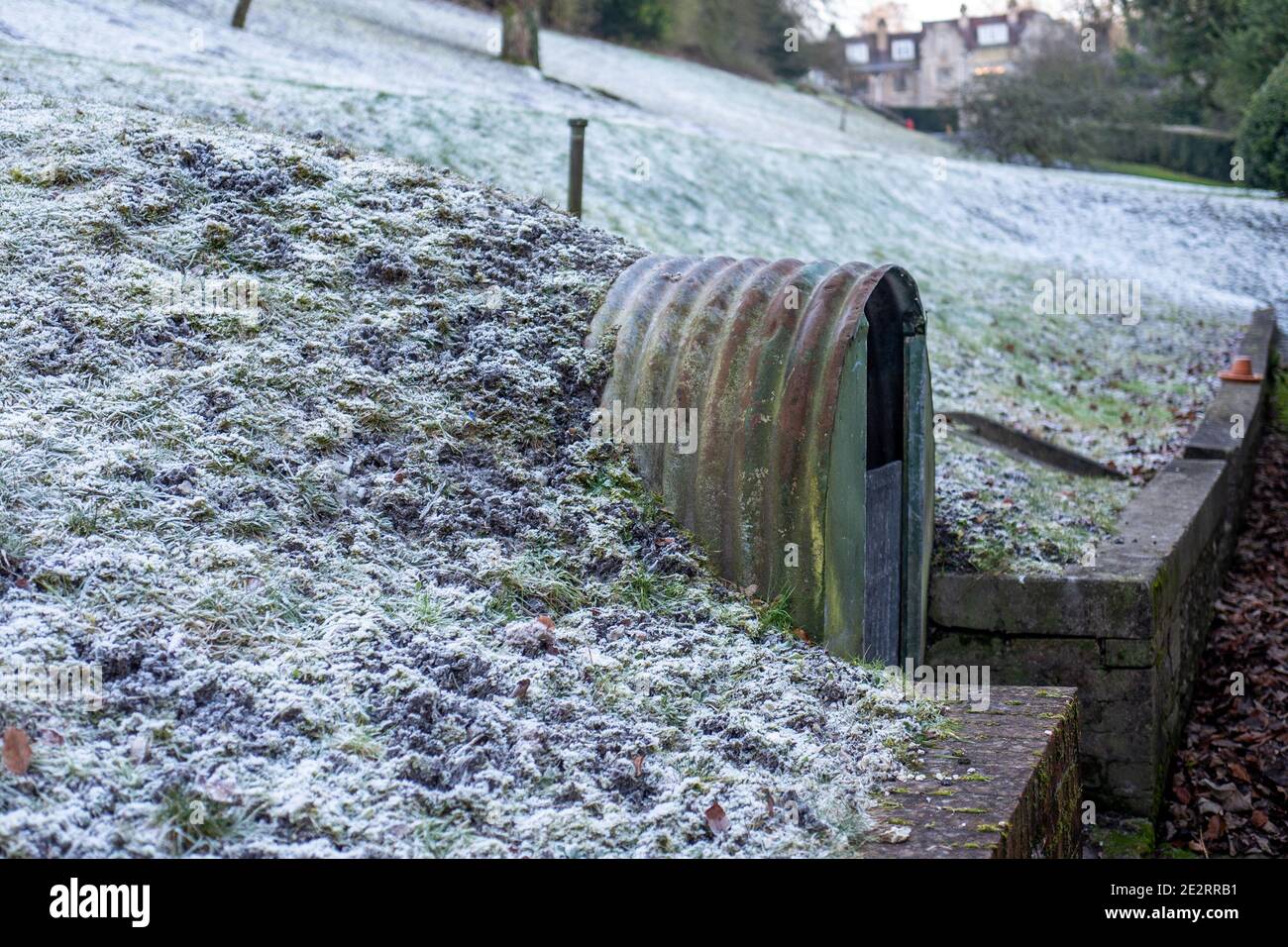 Abandoned Anderson shelter at the home of John Lewis, the founder of the general store in Hampshire. Stock Photo