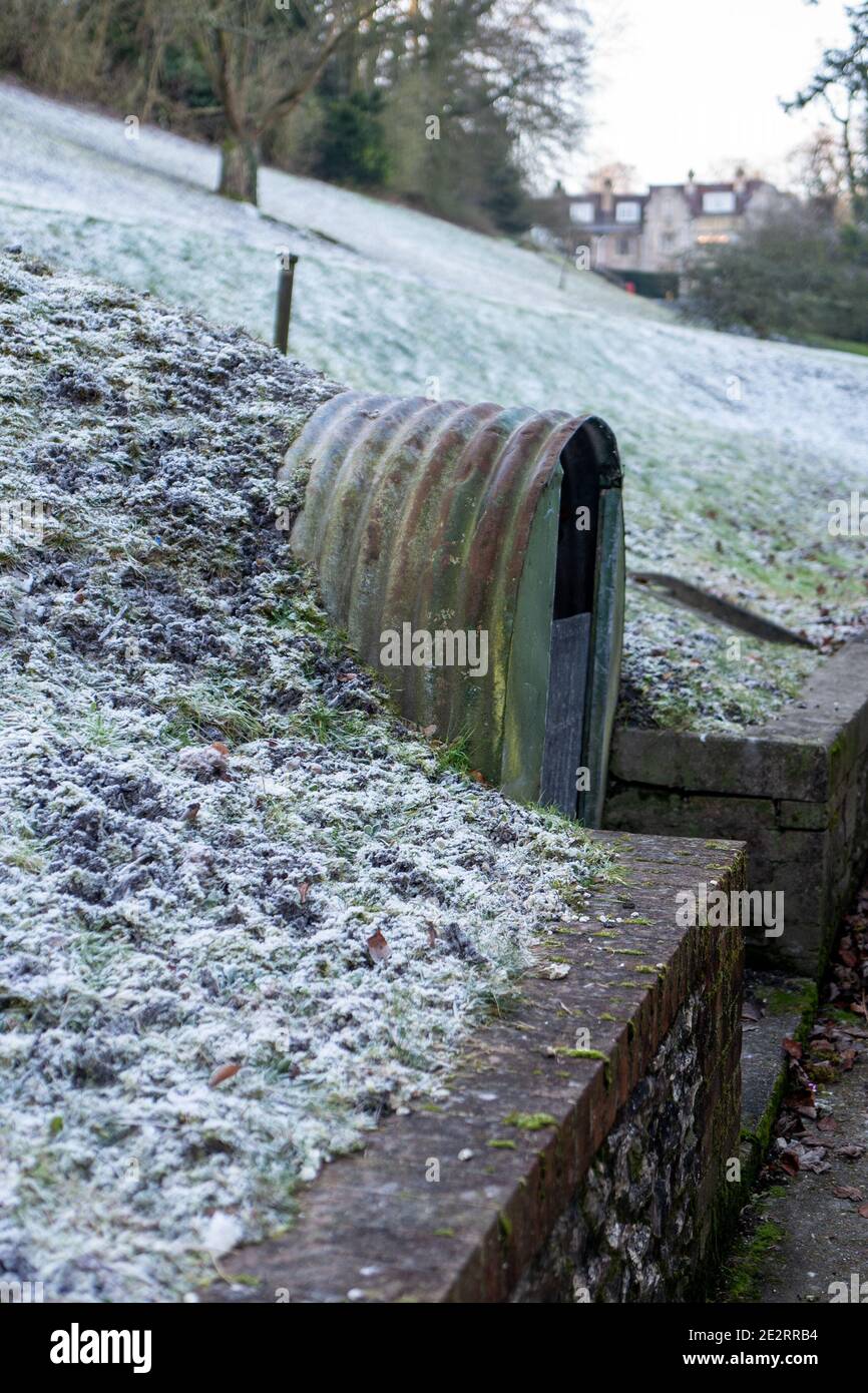 Abandoned Anderson shelter at the home of John Lewis, the founder of the general store in Hampshire. Stock Photo