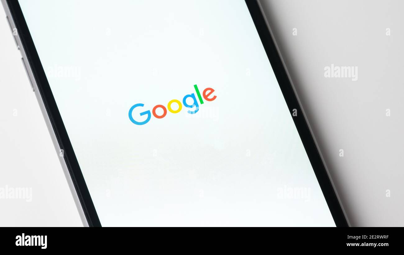 Google app launching on Apple iPhone Stock Photo