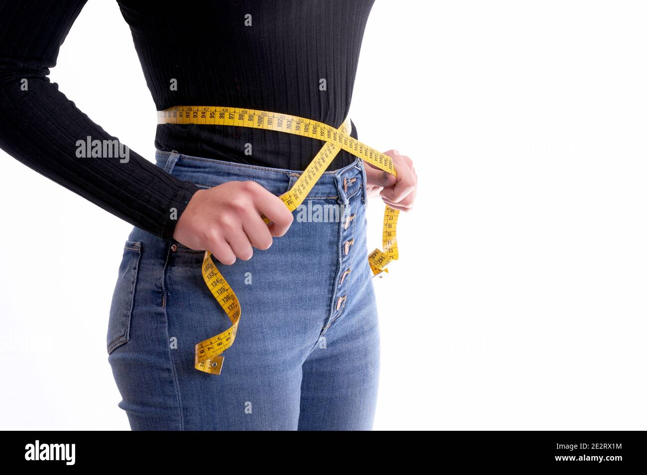 Woman holding tape measure around waist - Stock Image - F020/7701 - Science  Photo Library