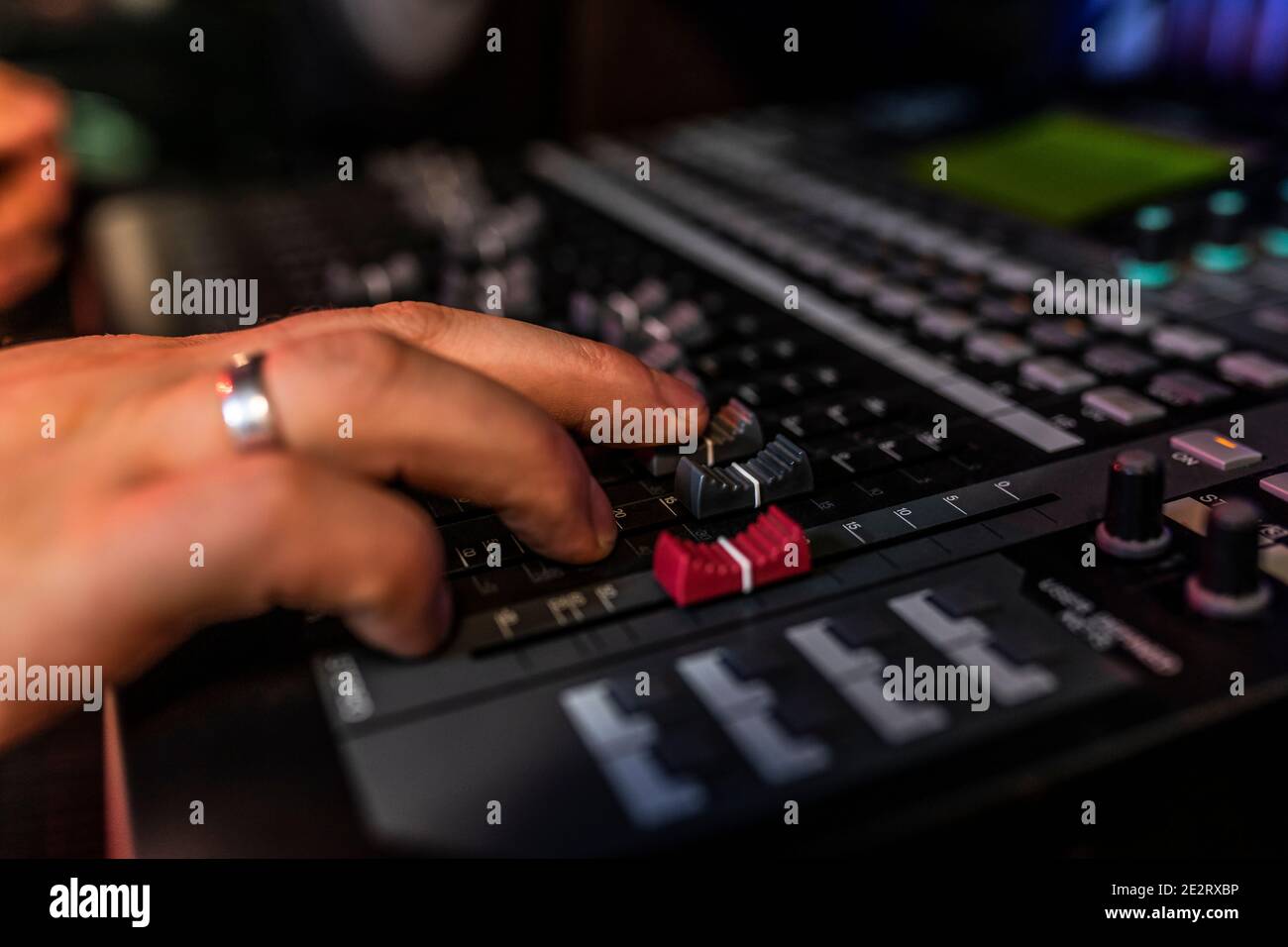 Close up mixer in the record studio where song writer is making his new ...