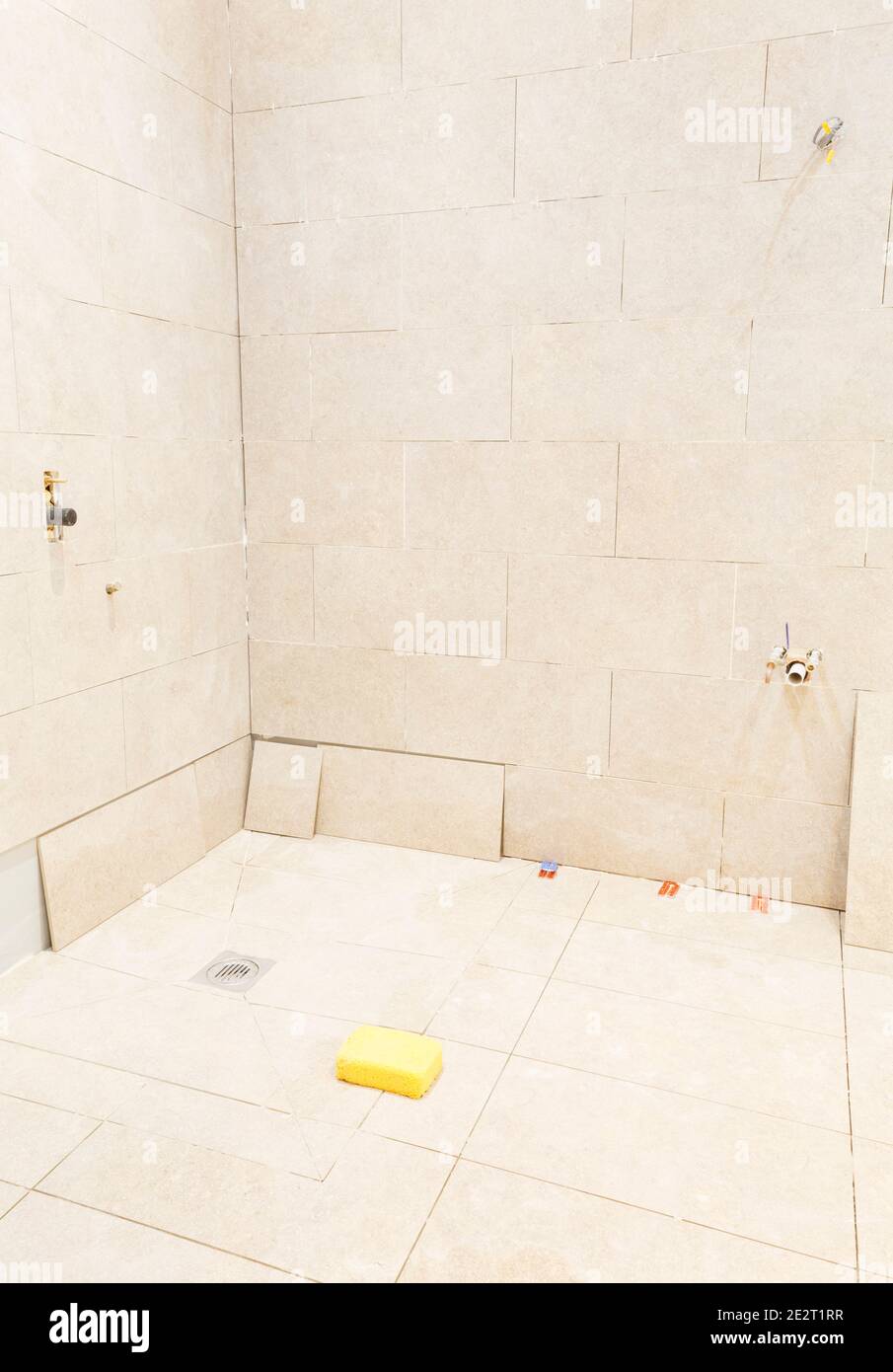 Bathroom wet room tiling and shower installation Stock Photo