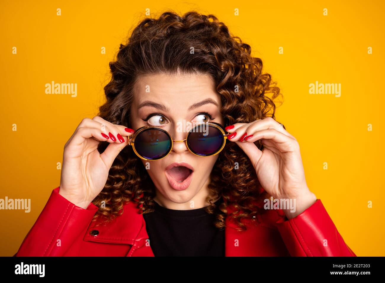 Portrait of astonished girl touch specs look copyspace isolated over ...