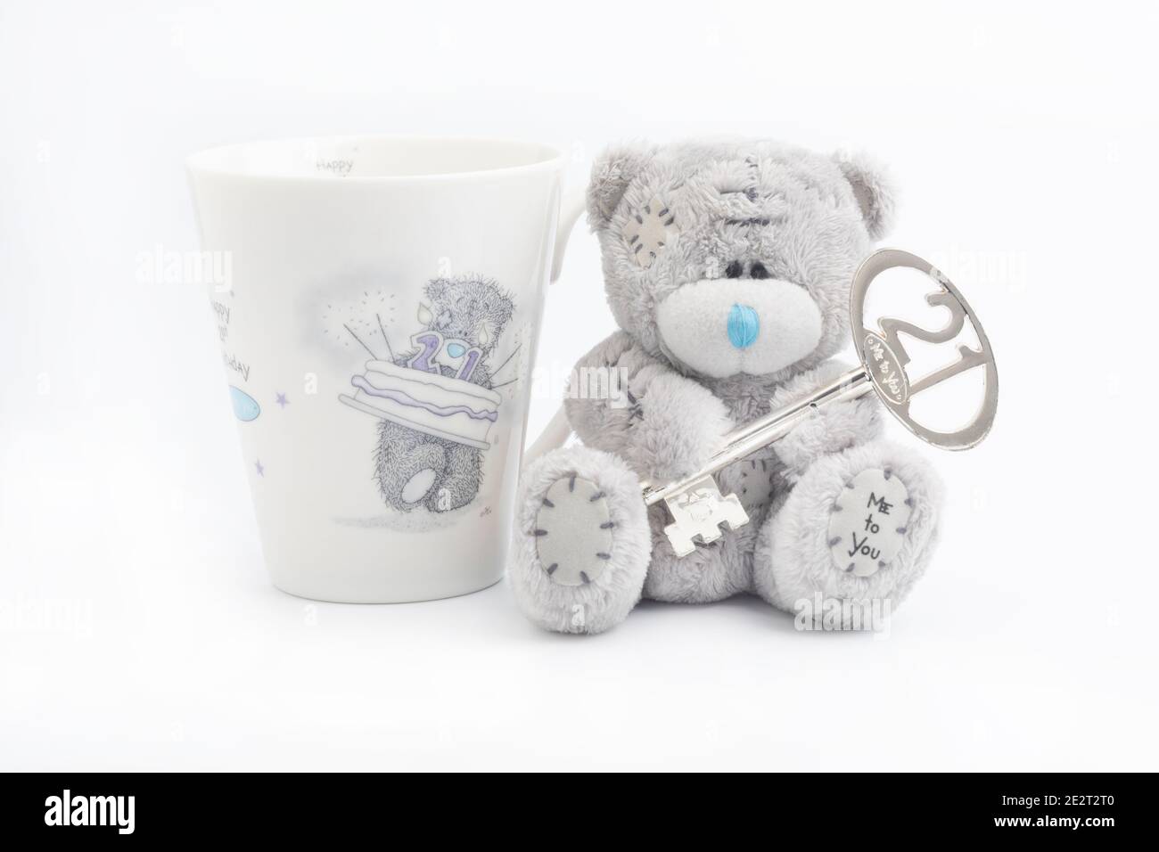 A twenty first birthday teddy bear and beaker Stock Photo