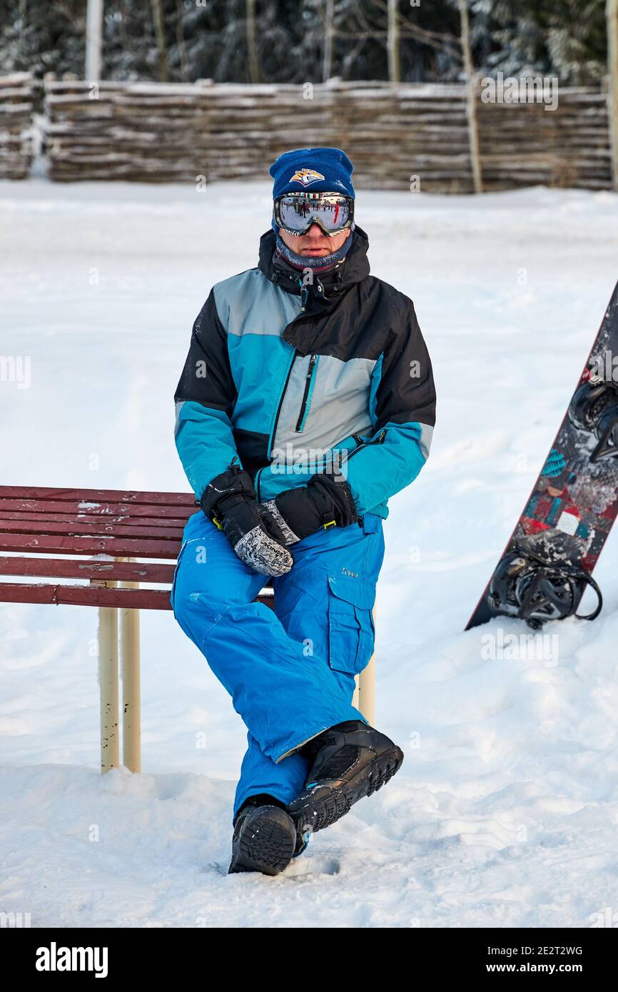 People go snowboarding and skiing, winter recreation and sports. Skiing  down mountain on snowboard, funny emotions on faces of men and women.  Russia Stock Photo - Alamy