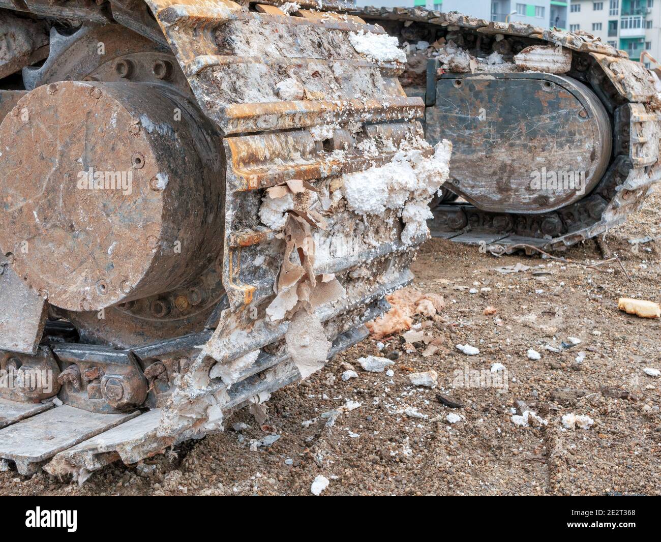 Close up detail with chain tracks of a bulldozer on a demolition site Stock Photo