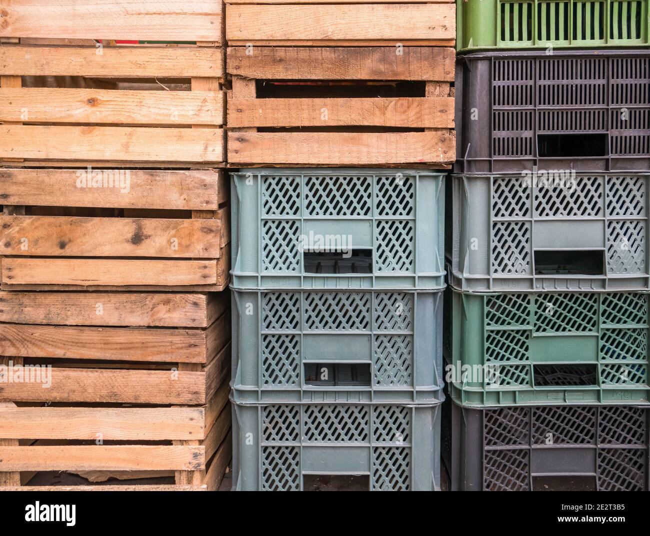Stack or pile of wooden and plastic crates for fruits and vegetables