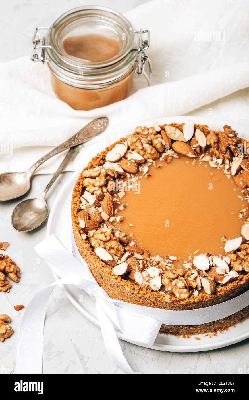 Cheesecake with salted caramel and nuts Stock Photo Alamy