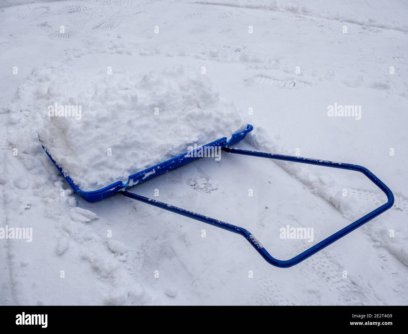 Winter road clearance with a snow shovel Stock Photo Alamy