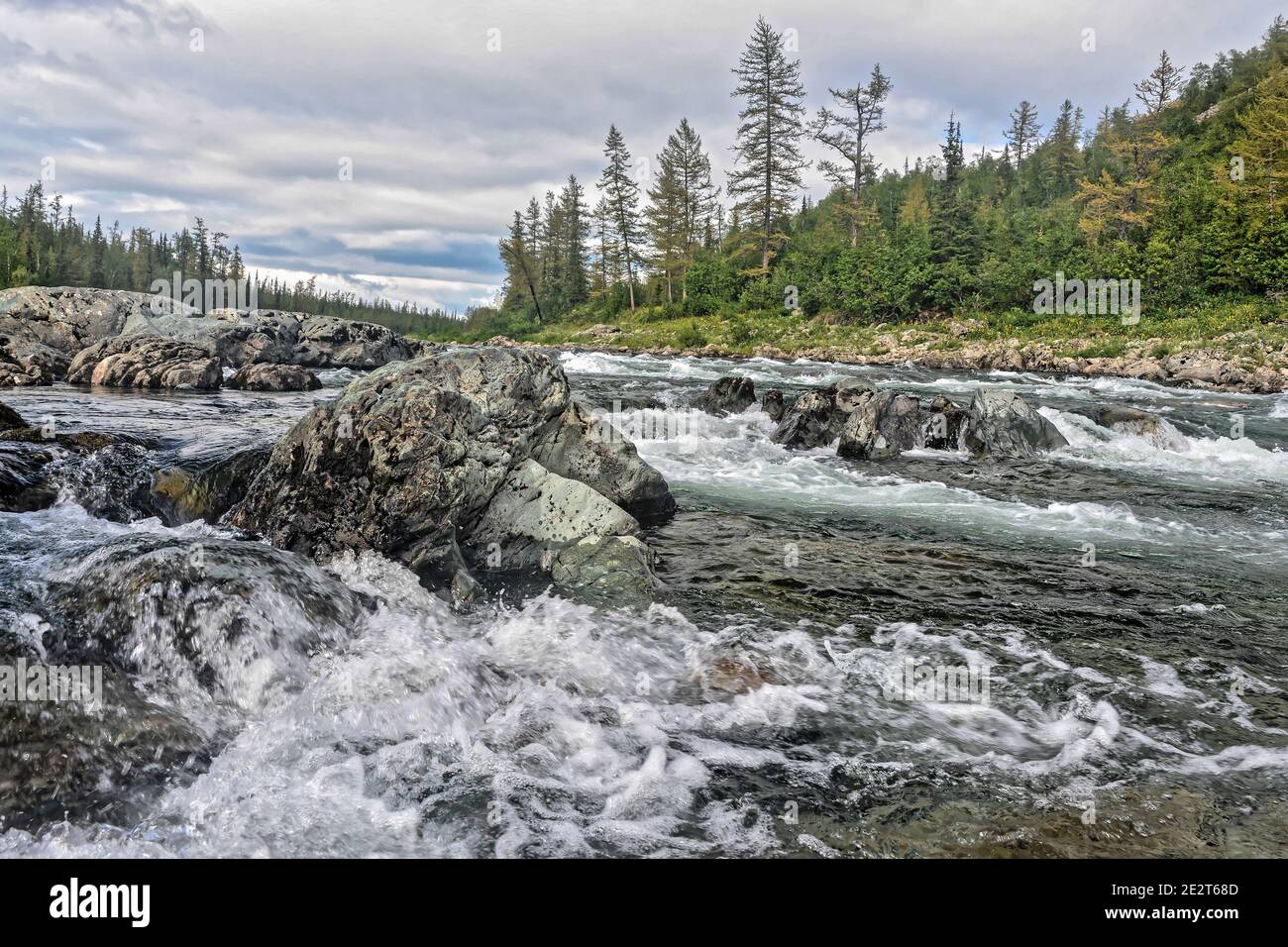 A rapid on the north river. Landscape with white water on a rapid. Stock Photo