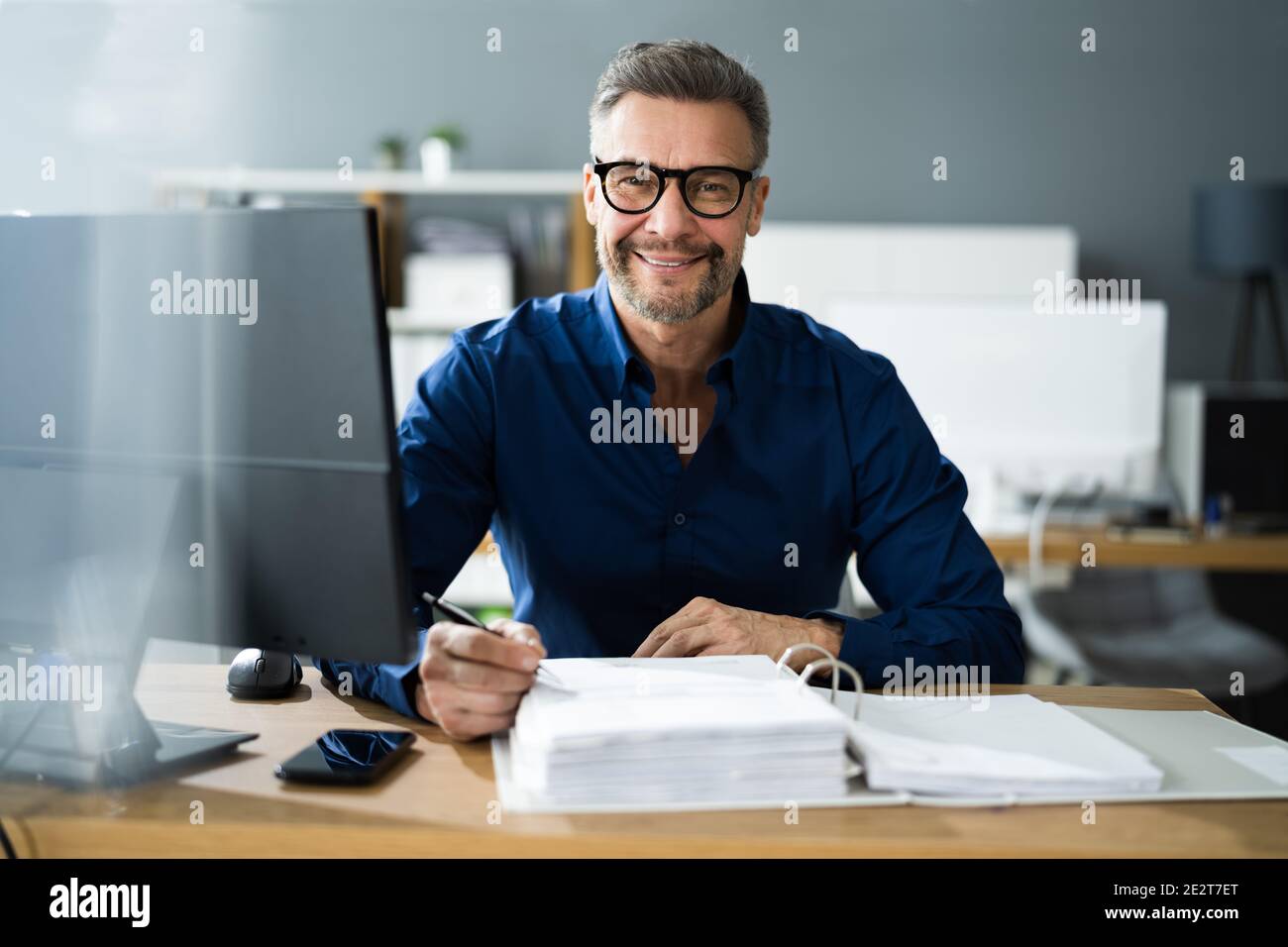 Tax Accountant Advisor Man Doing Sales Invoice Accounting Stock Photo