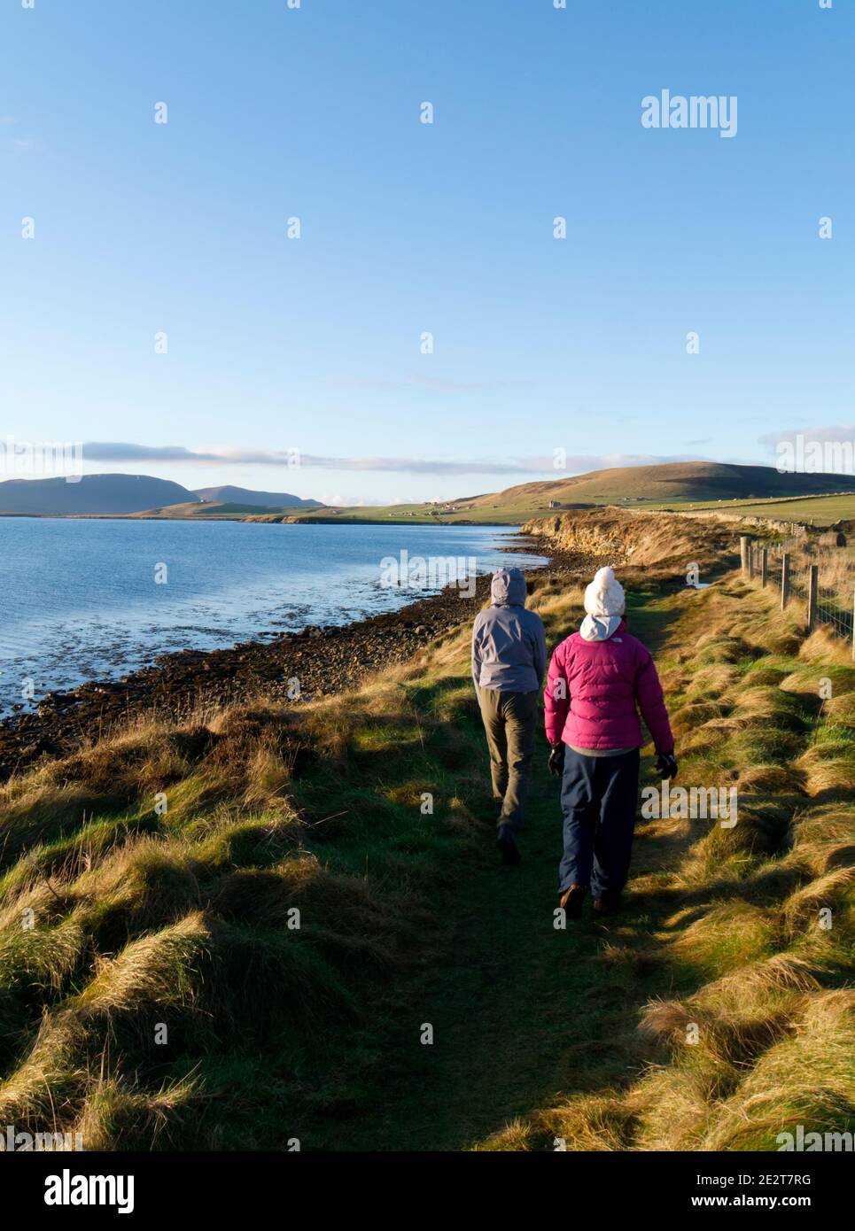 Walking on coastal path, Orkney Isles Stock Photo