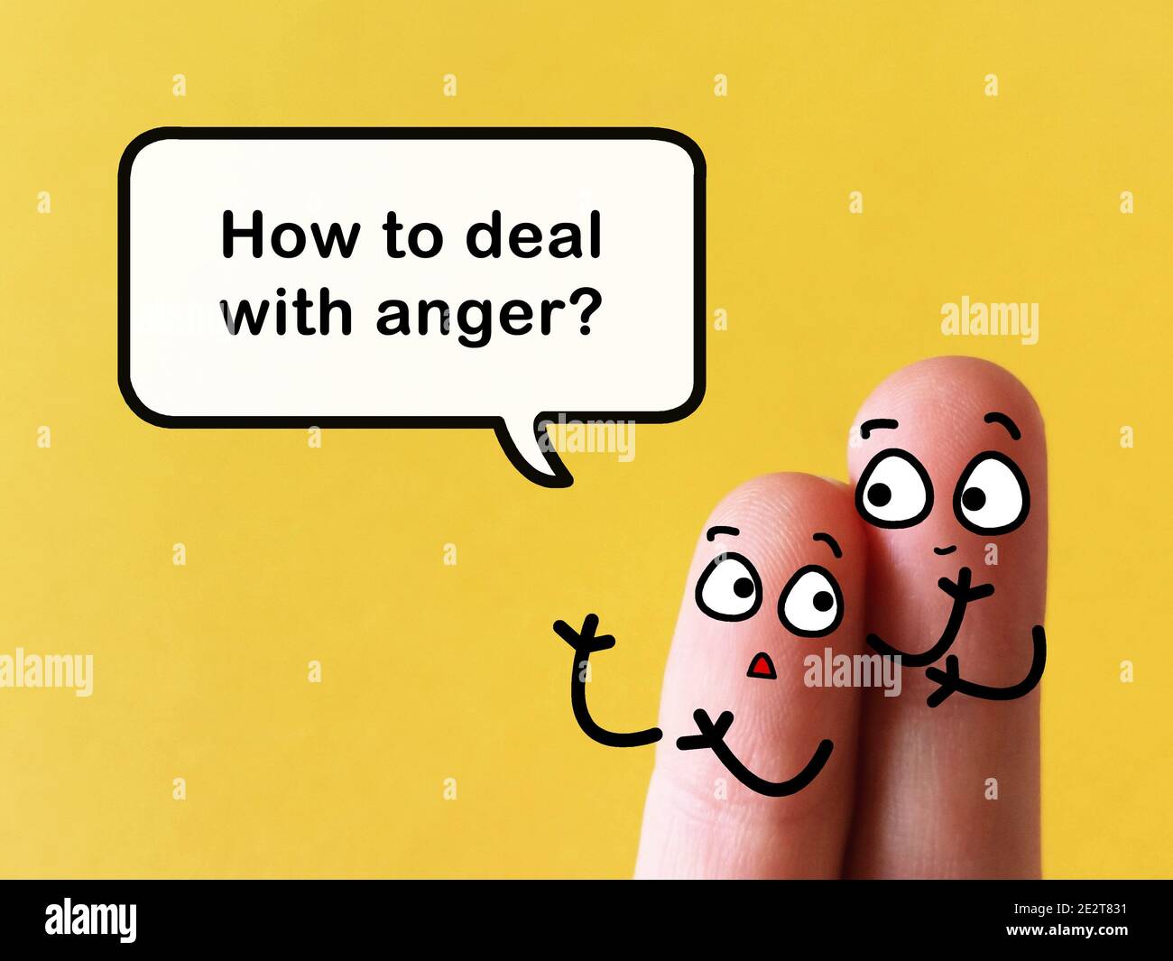 Two fingers are decorated as two person at work. They are discussing ...