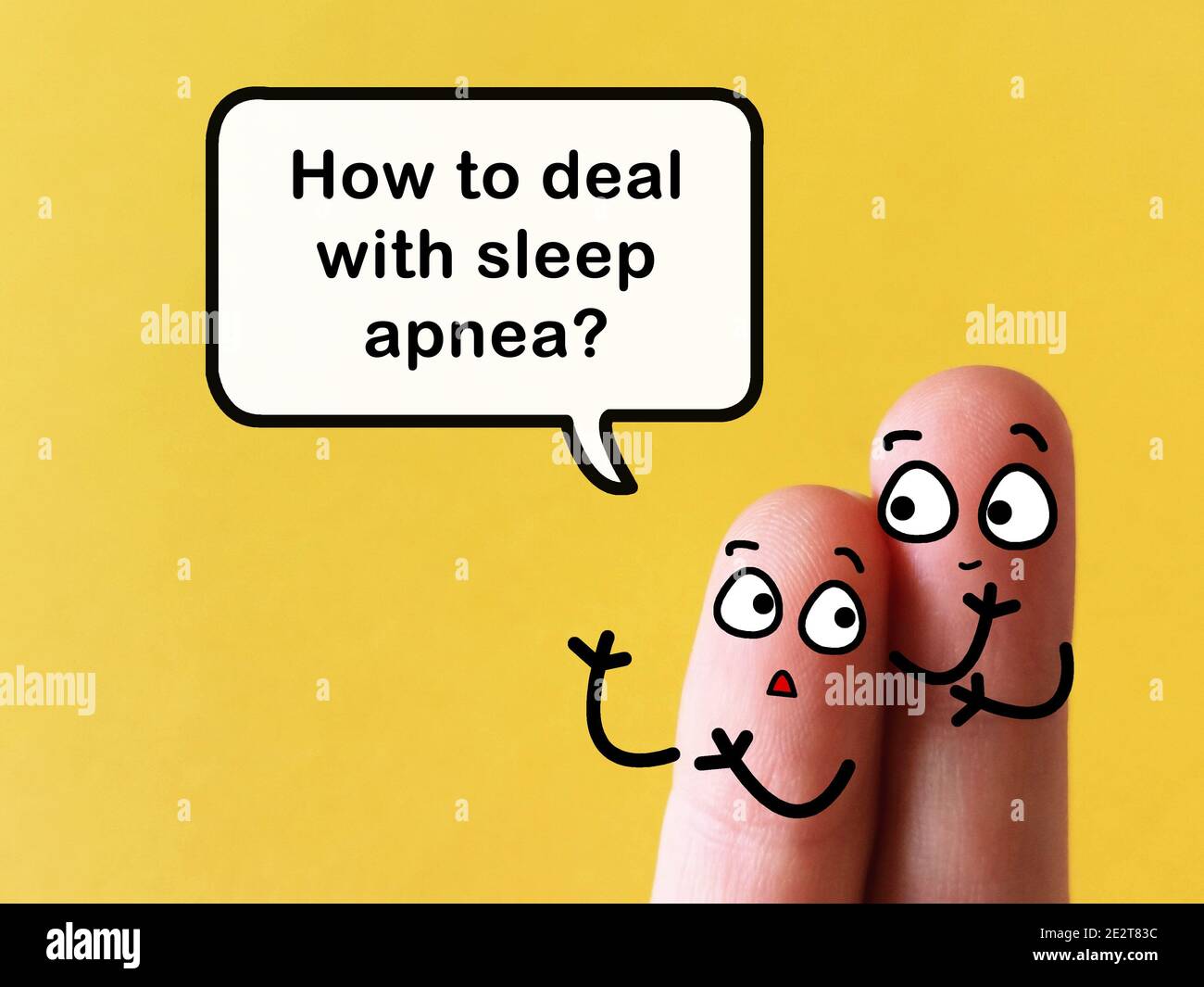 Two fingers are decorated as two person at work. They are discussing