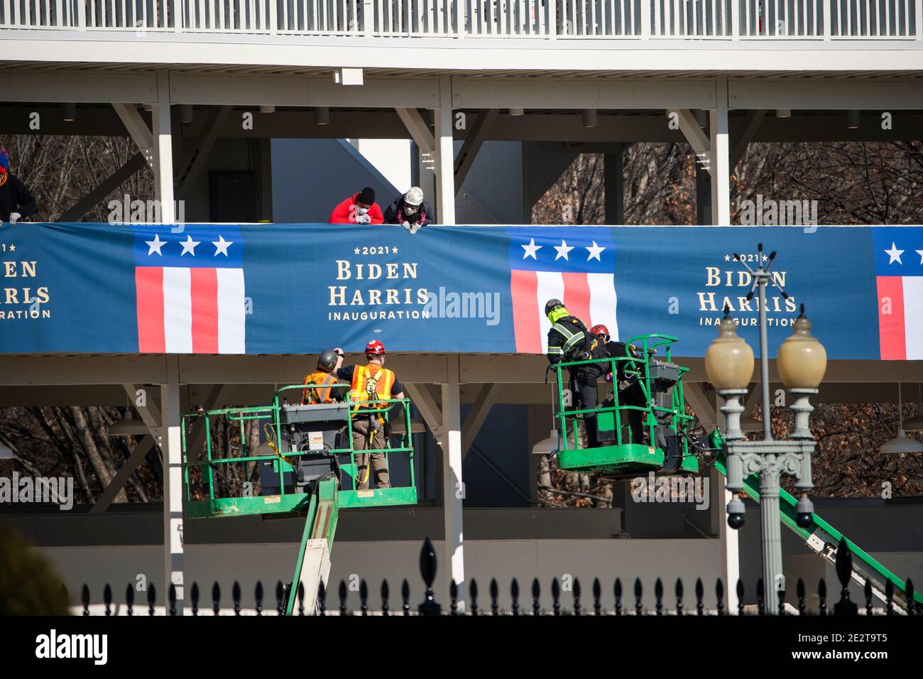 Workers hang bunting from a media riser for President-elect Joe Biden's inauguration parade outside the White House in Washington, DC, USA, 14 January 2021.Credit: Jim LoScalzo/Pool via CNP /MediaPunch Stock Photo