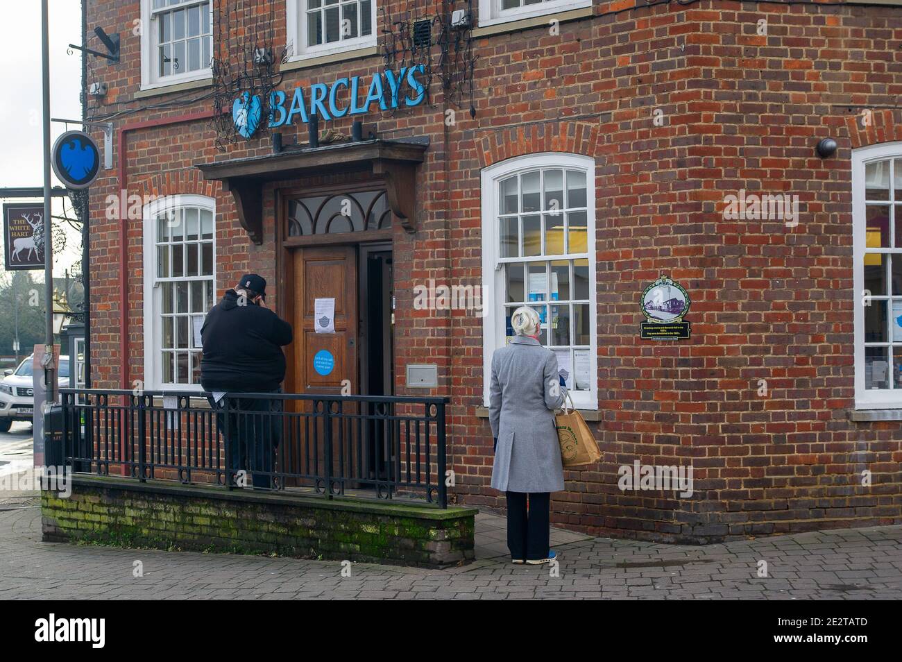 Chalfont St Peter, Buckinghamshire, UK. 15th January, 2021. People queue outside Barclays bank. It was a quiet morning in the village of Chalfont St Peter this morning as many people continue to stay at home following Government advice during the latest Covid-19 lockdown. Credit: Maureen McLean/Alamy Live News Stock Photo