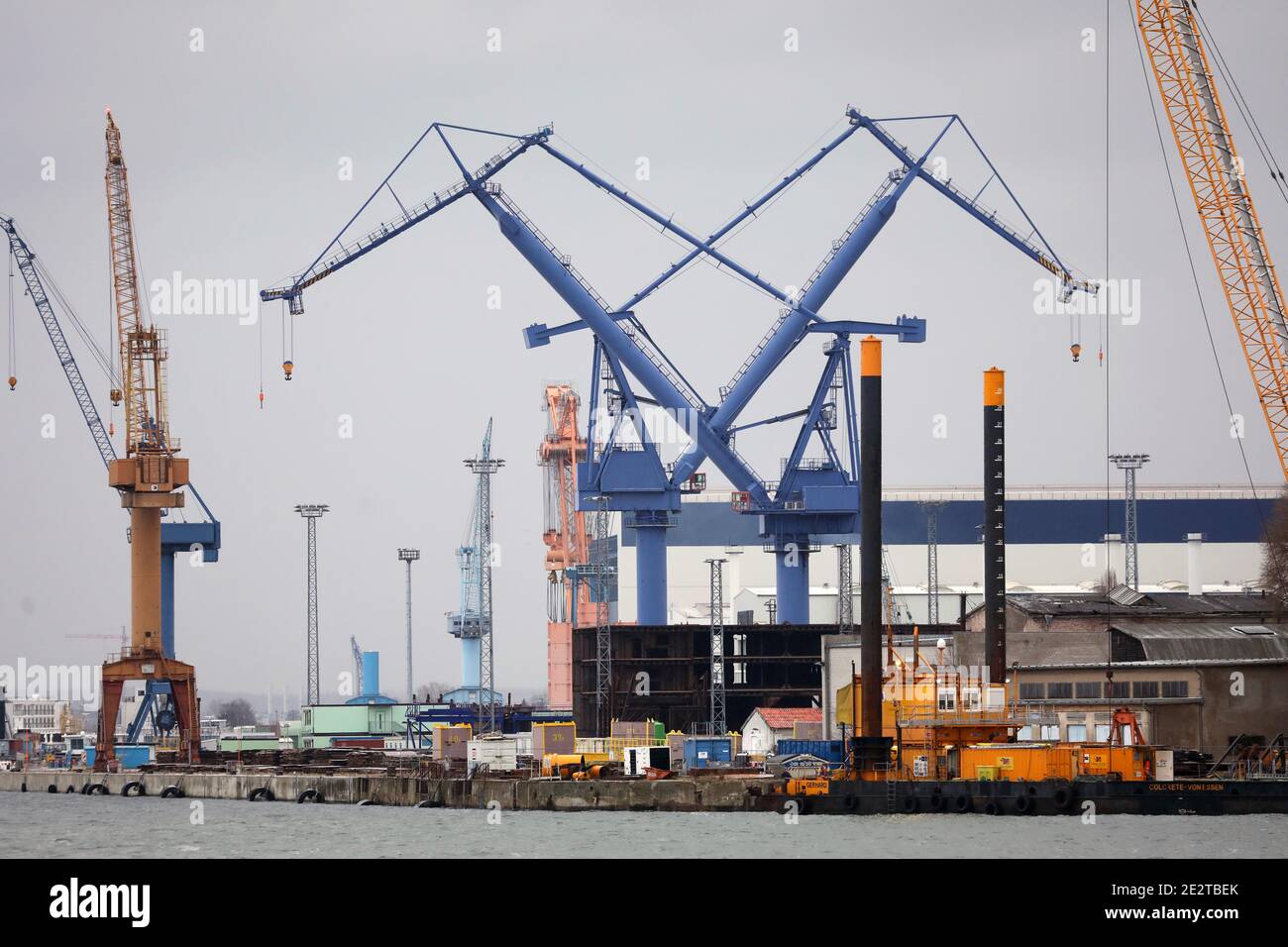 15 January 2021, Mecklenburg-Western Pomerania, Warnemünde: Cranes stand at the Warnemünde shipyard of MV Werften. Photo: Bernd Wüstneck/dpa-Zentralbild/dpa Stock Photo