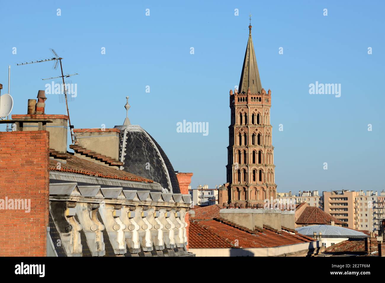 View Over the Rooftops & Skyline of the Old Town, Historic District or Town Centre & Spire of the Basilica of Saint Sernin Church Toulouse France Stock Photo