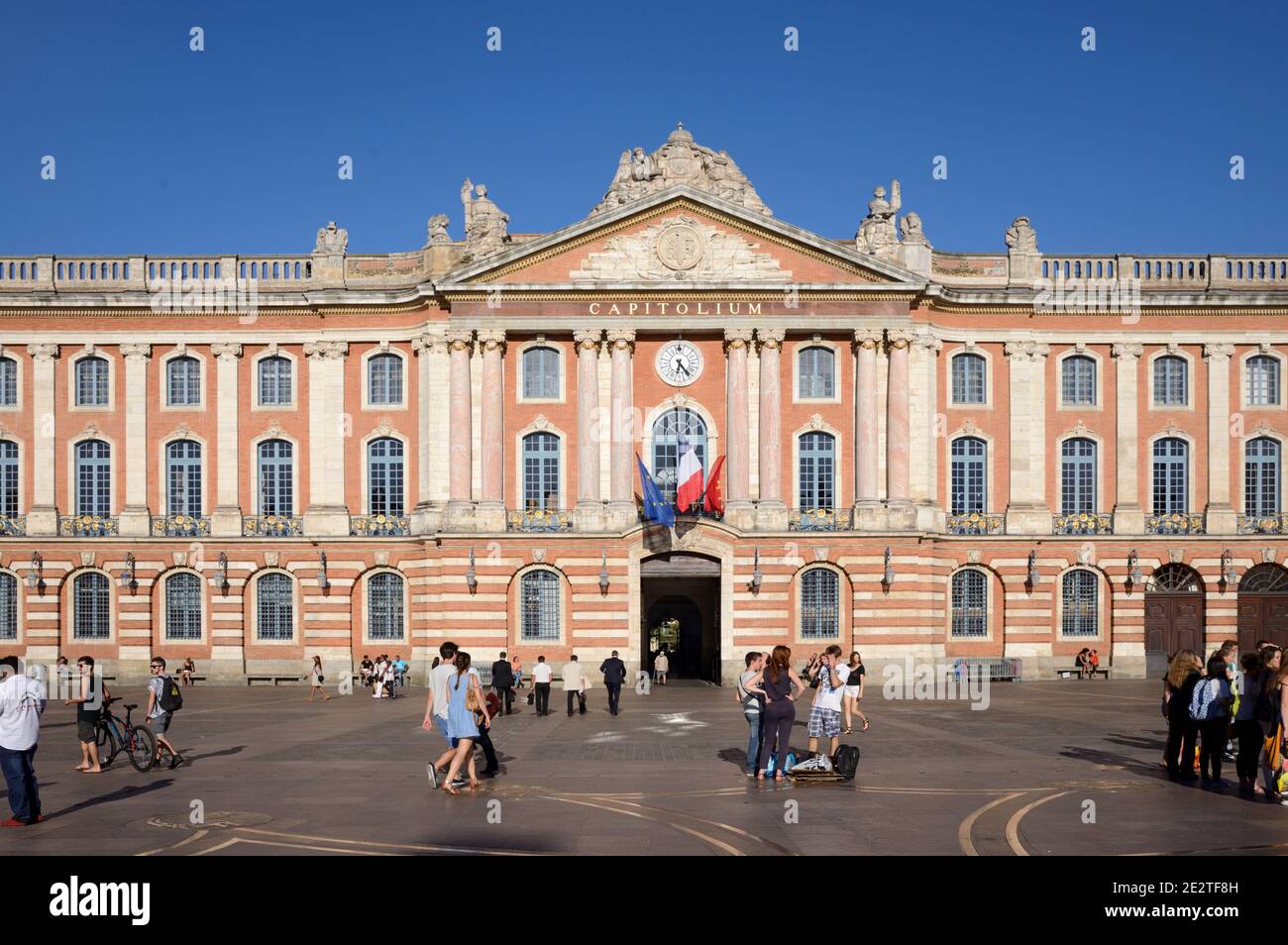 Tourists & Locals Mingle in the Capitole Town Square or Plaza with the Town Hall or City Hall, the Capitolium (1750-1760), Toulouse France Stock Photo