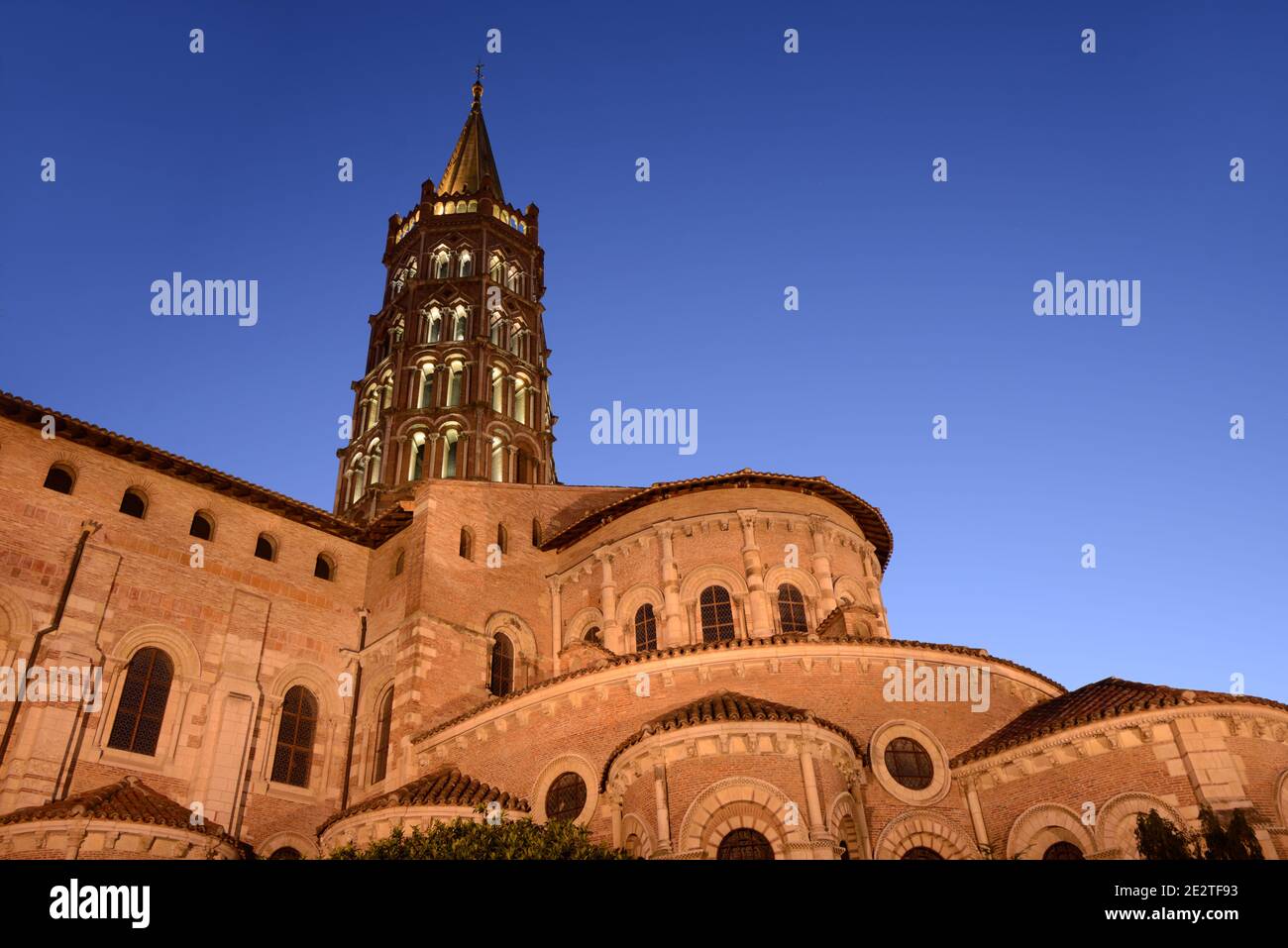 Basilica of Saint Sernin at Night or Dusk, Landmark Romanesque Church Toulouse france Stock Photo