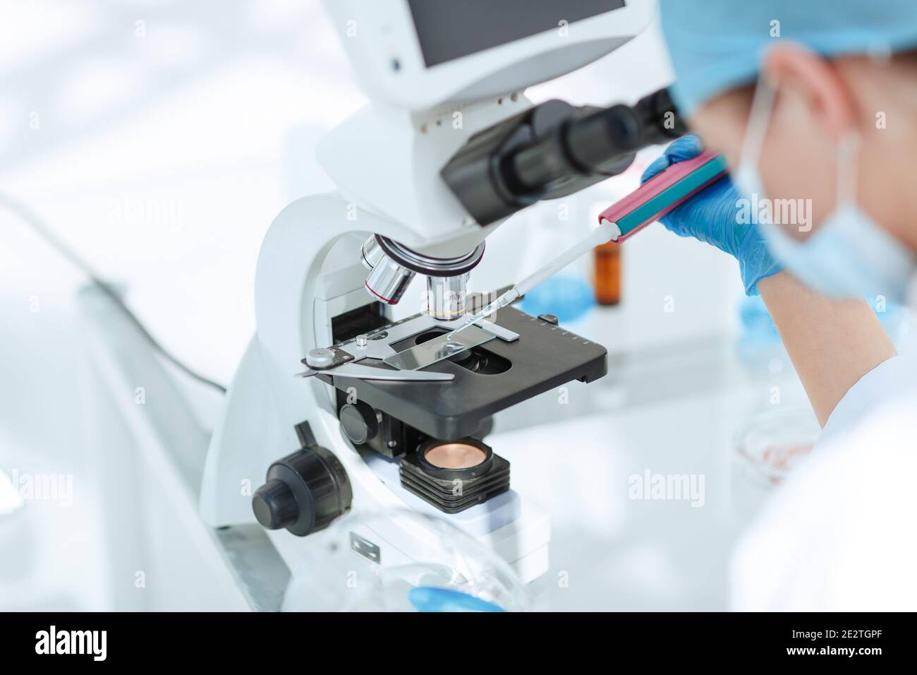 close up. researcher testing the blood under a microscope Stock Photo