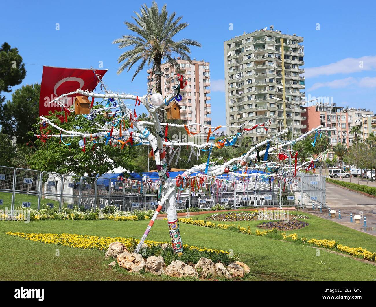 ADANA,TURKEY-APRIL 9:Decorated tree,waving turkish flag and Condominiums.April 9,2017 in Adana,Turkey. Stock Photo