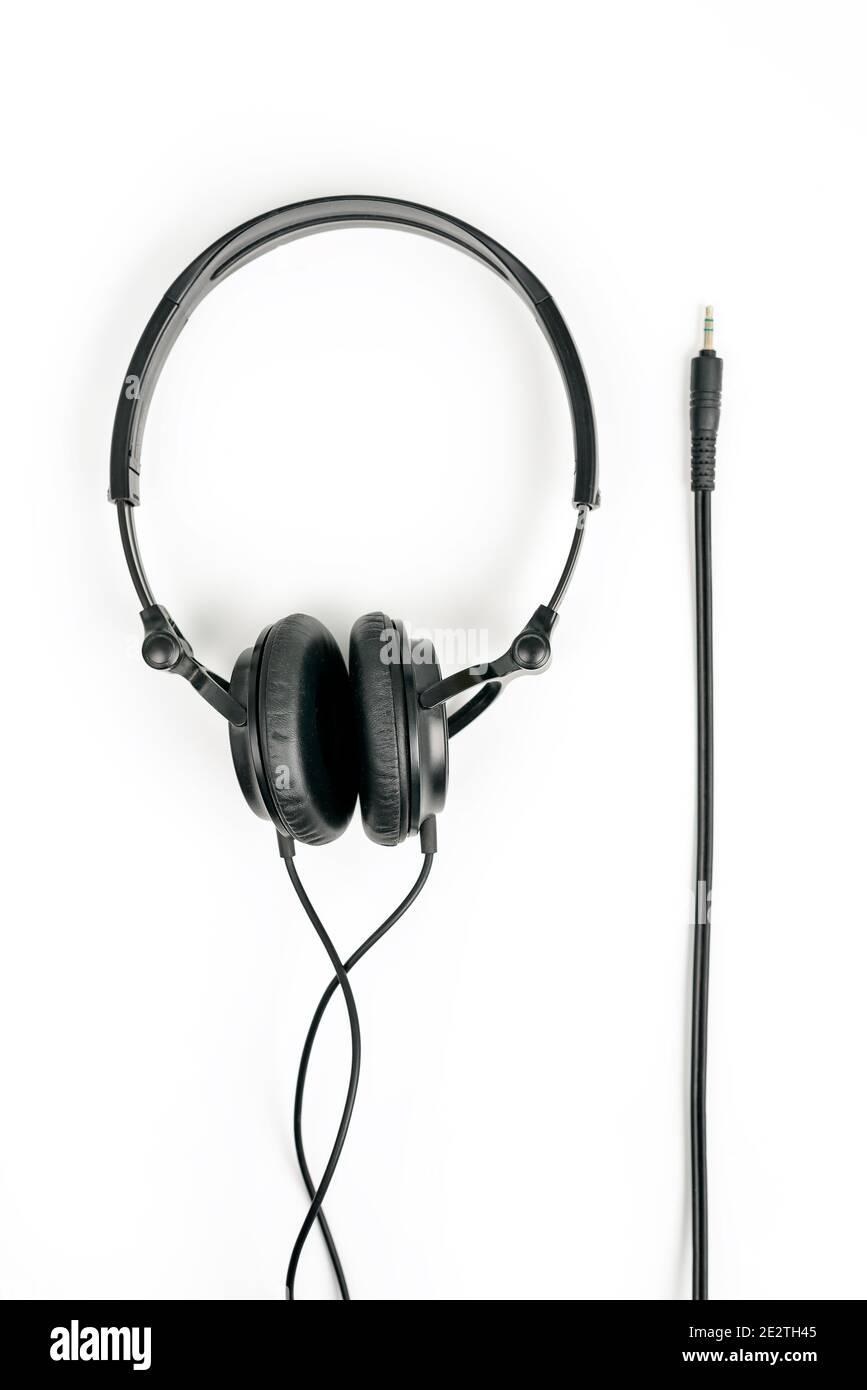 Black headphones on white background with 3,5 mm jack for plug in Stock Photo Alamy