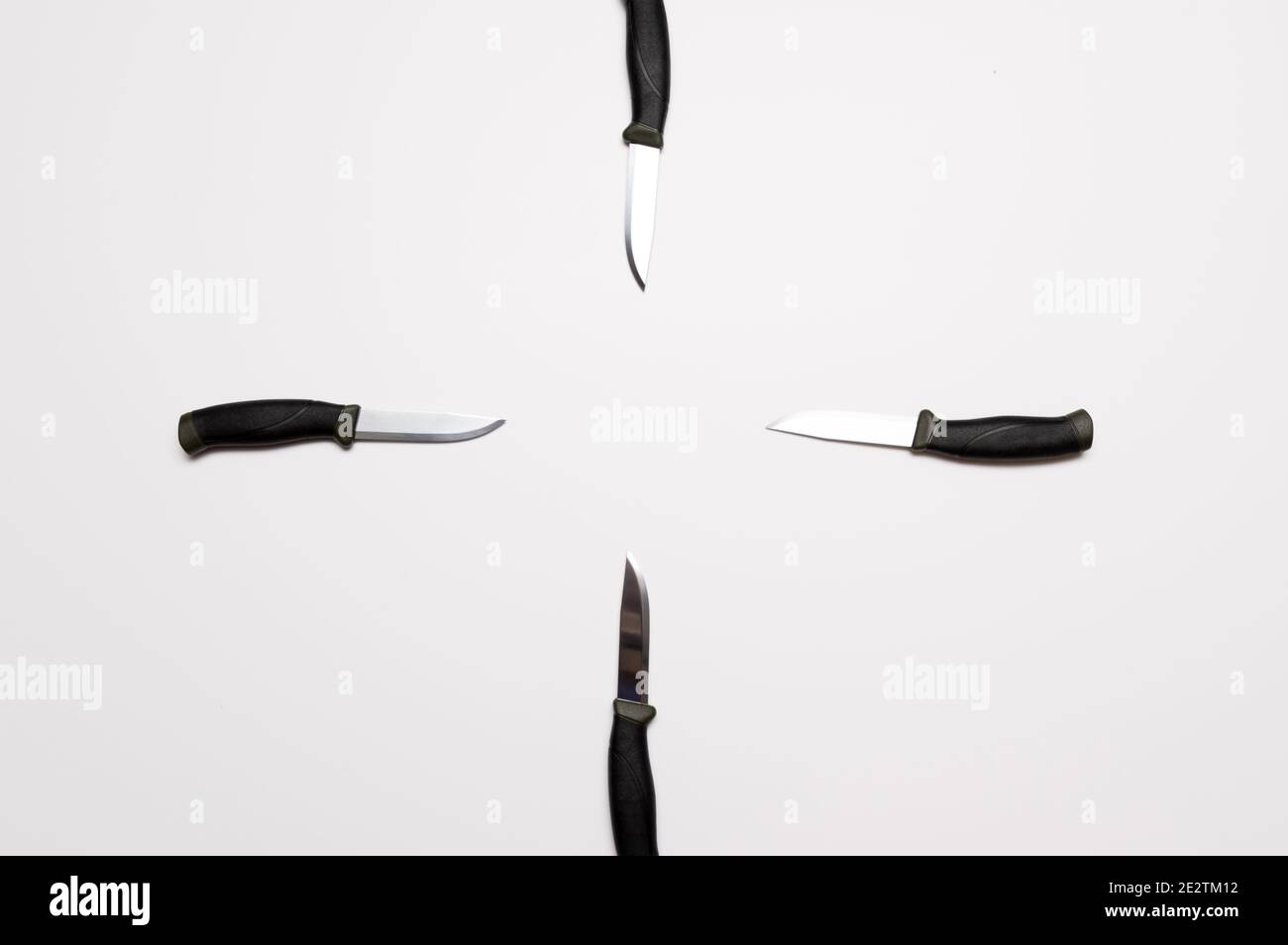 Targetshaped knives. Several knives on a gray background. Target of