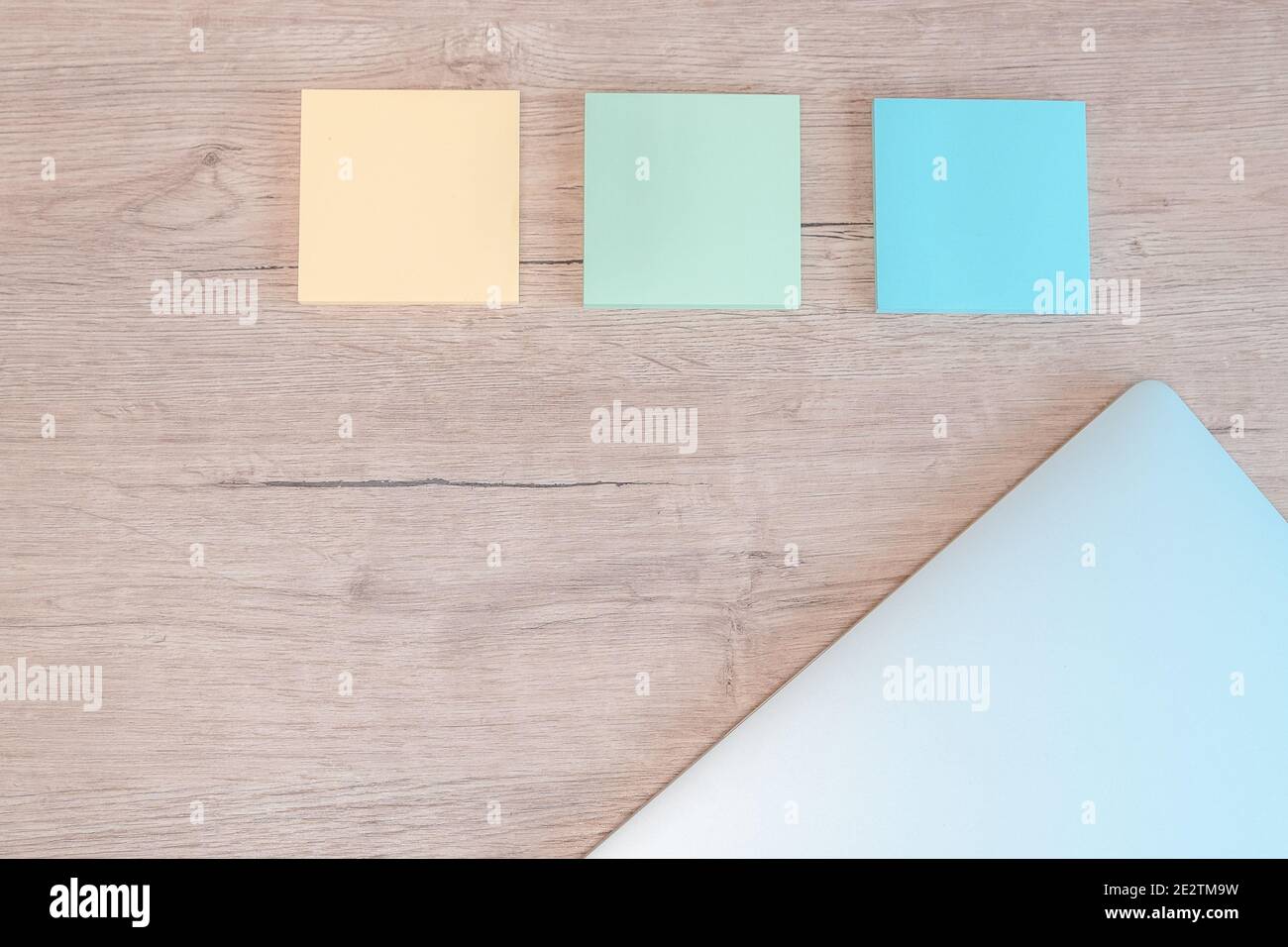 close up. sticky notes and a laptop on the table. Stock Photo